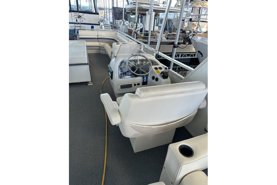 2008 Destination Yachts 45X14 boat interior with steering wheel and seating area.