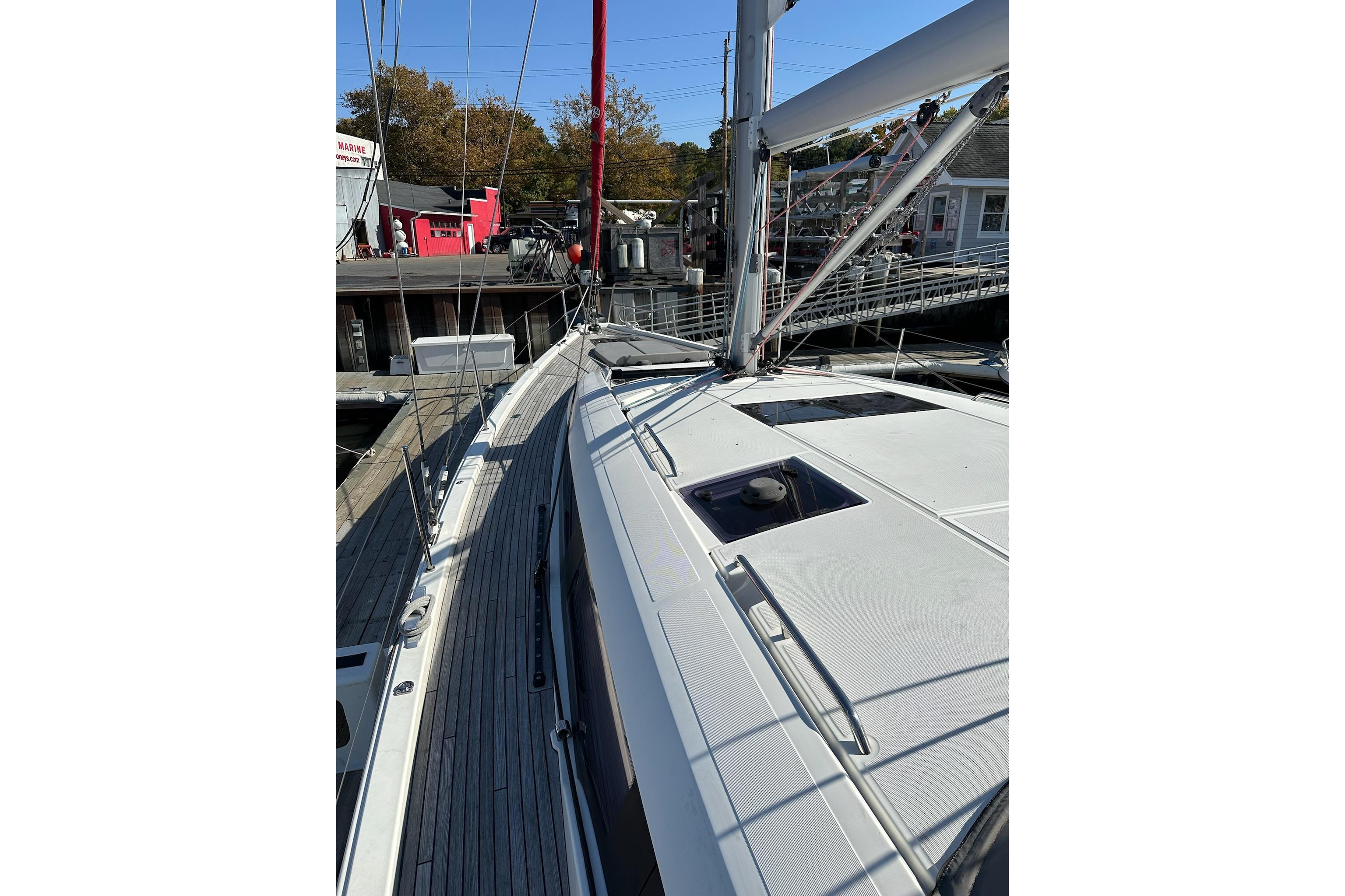 2018 Jeanneau 51 sailboat docked, showcasing sleek deck design and modern rigging.