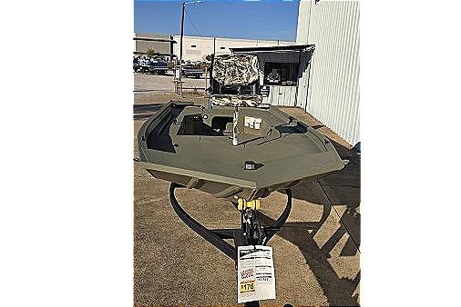 2025 Tracker Grizzly 1654 T Sportsman boat displayed outdoors on a trailer.
