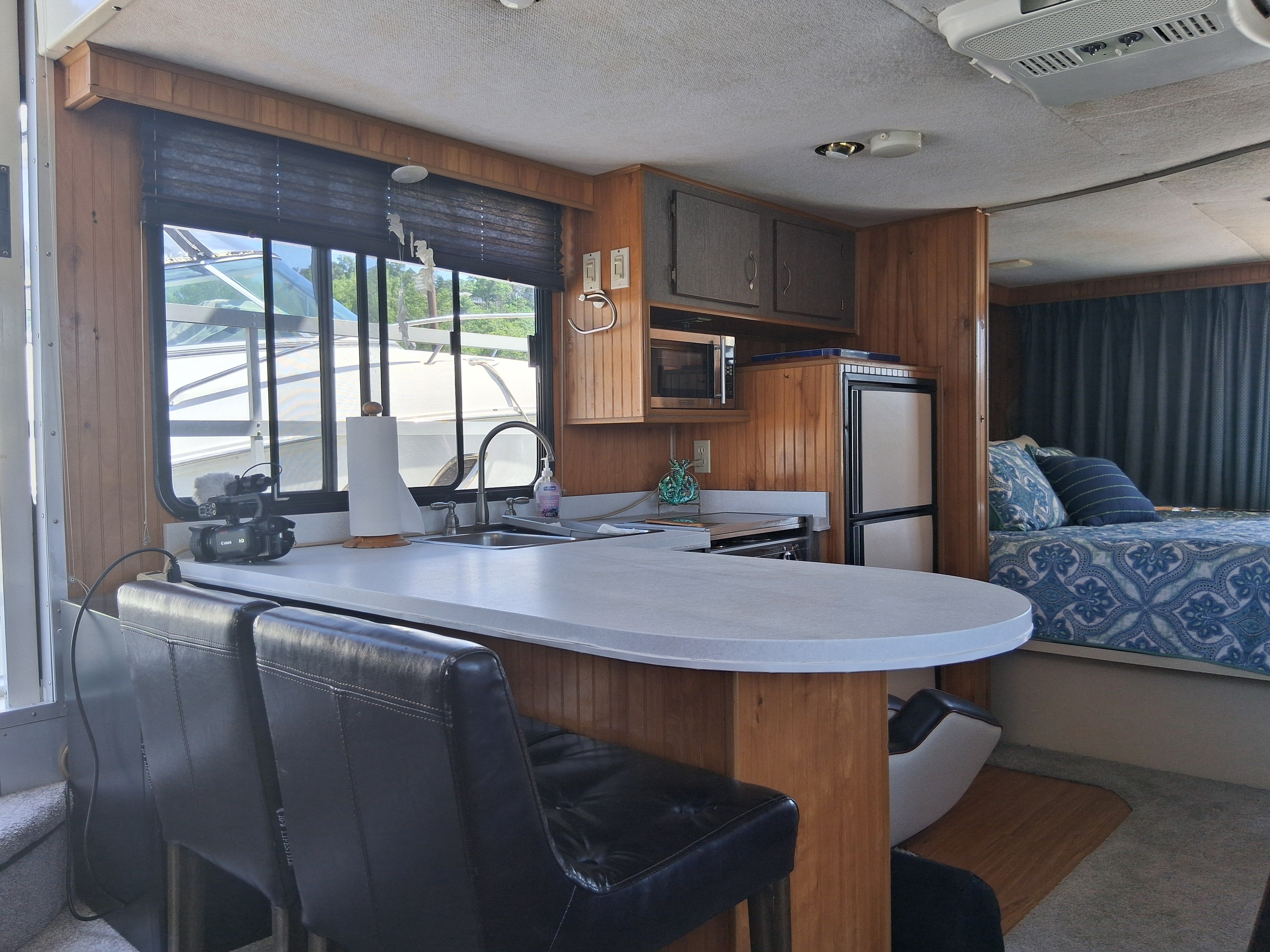 Interior of a 1993 Gibson 370 Sport featuring a kitchen and sleeping area.
