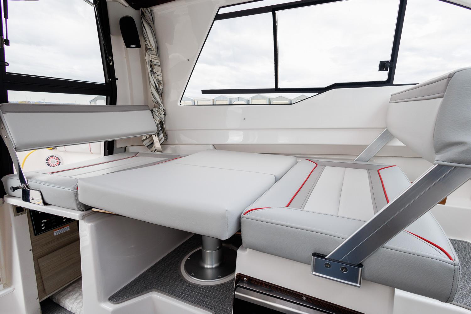 Interior of 2026 Solara 250-C boat with convertible seating and modern design.