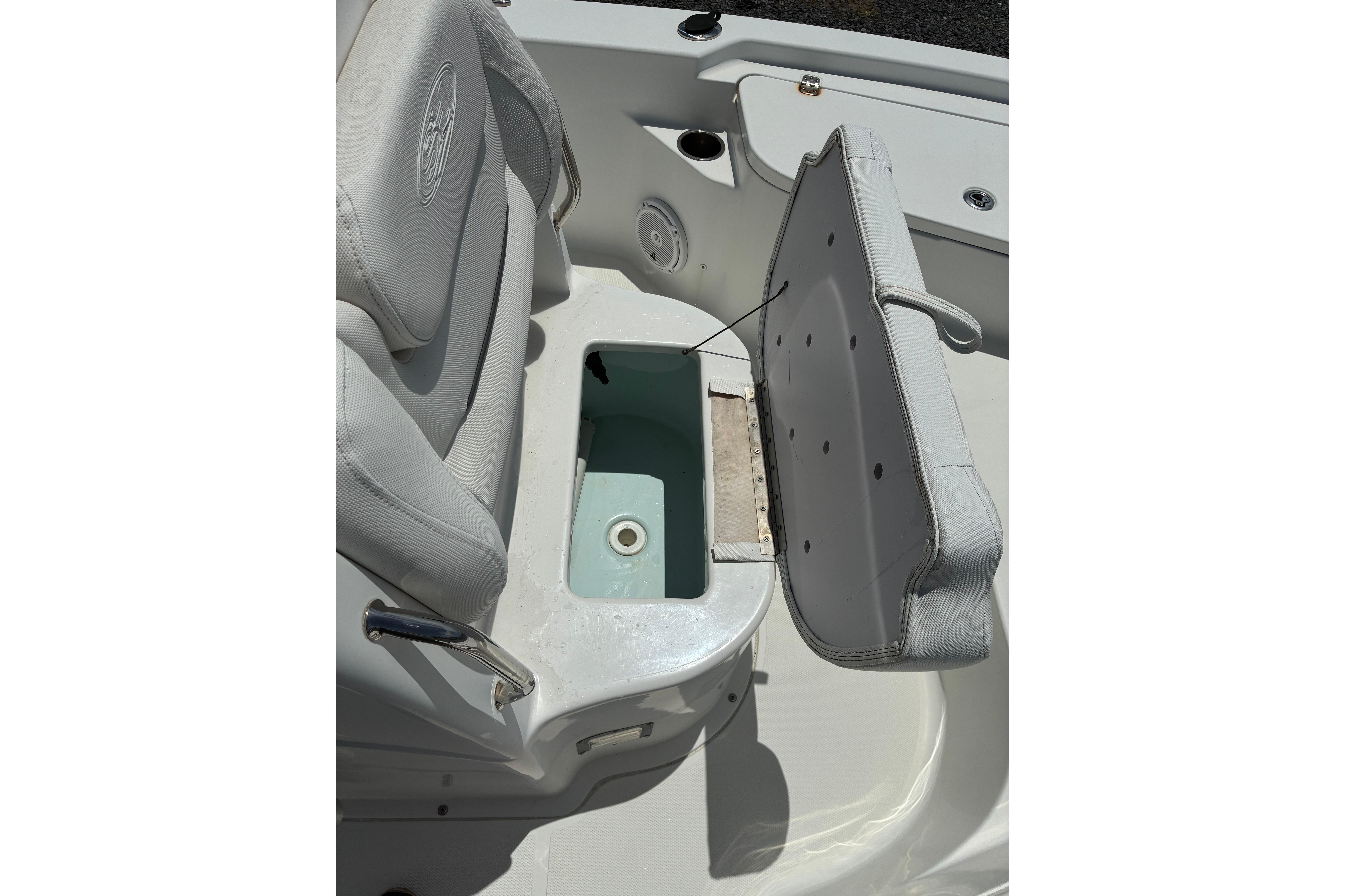 2014 Sea Hunt BX 20 BR boat seat with storage compartment open.