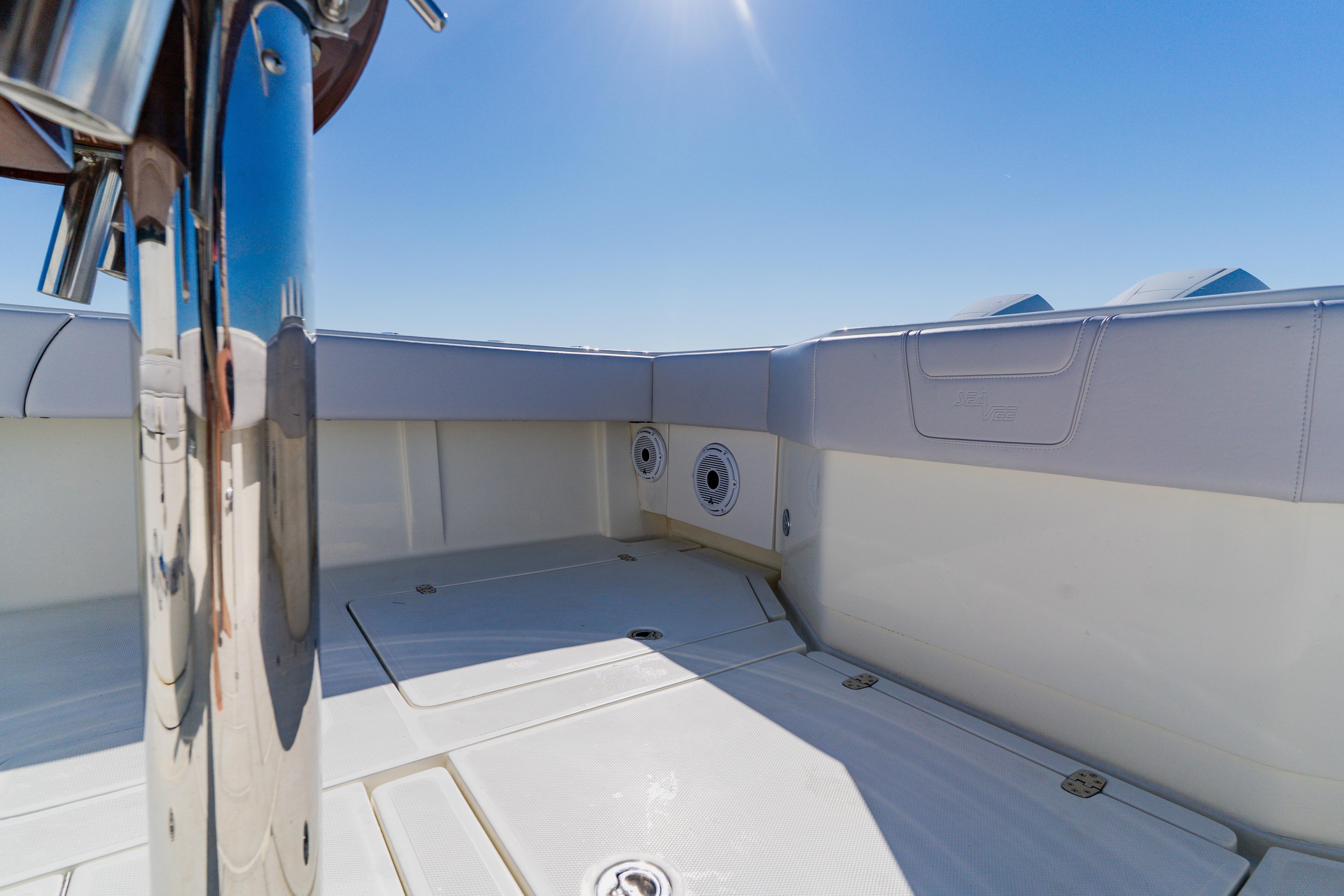 2012 SeaVee 390B boat deck with polished metal and clear blue sky.