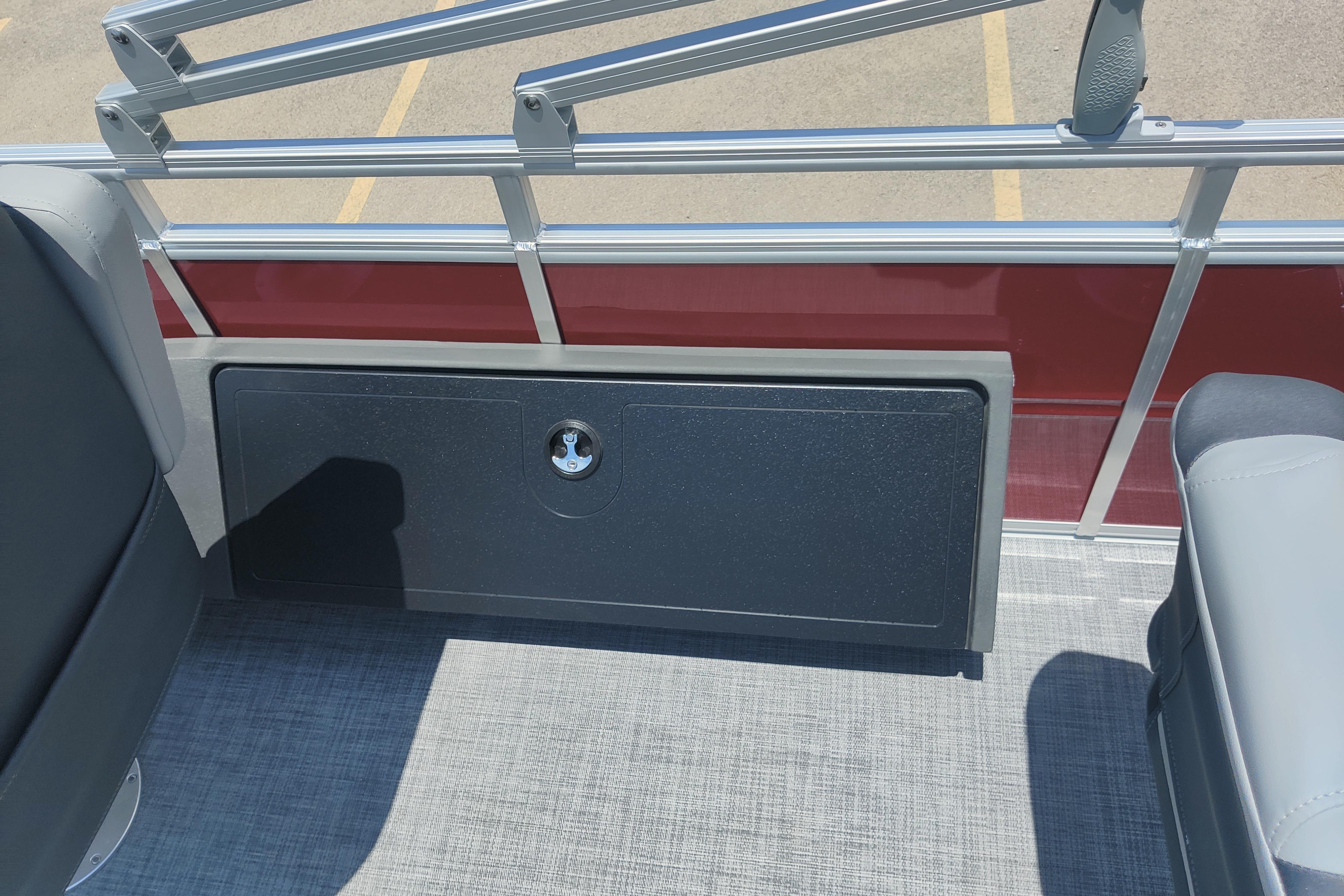 Interior view of 2026 Sun Tracker SportFish 22 DLX pontoon boat with seating and storage.