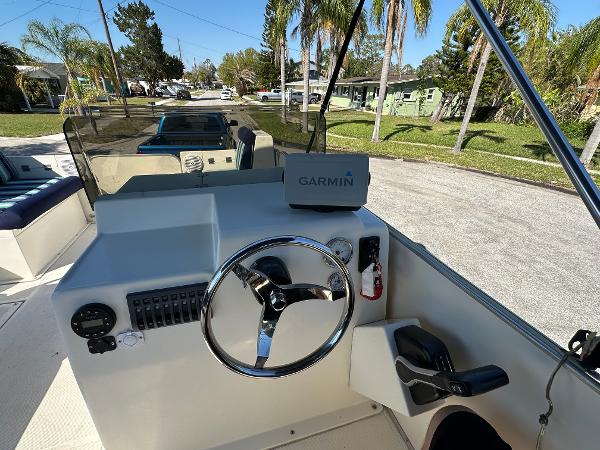 Steering console of a 2020 Beachcat 20 boat with Garmin navigation system.