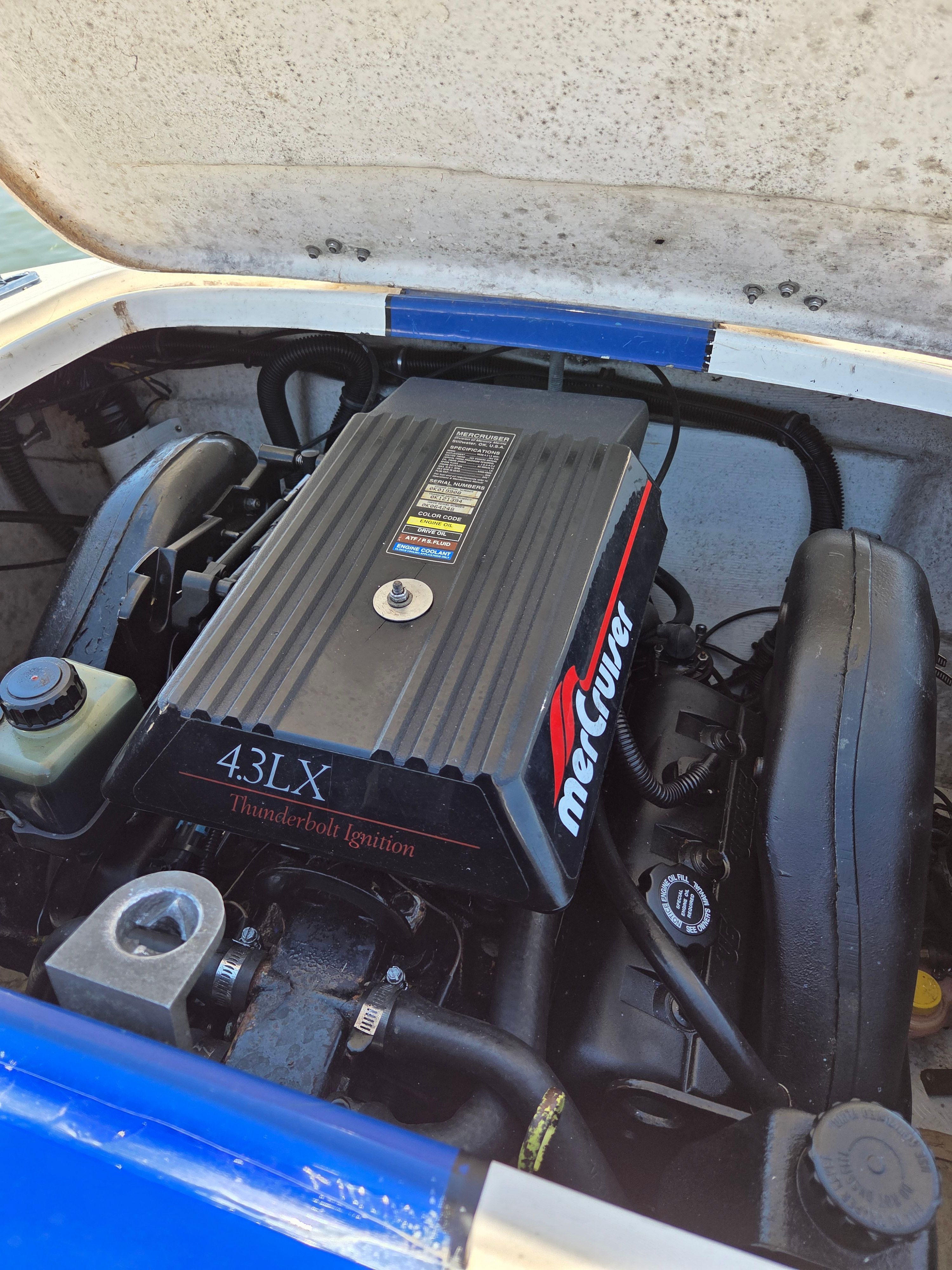 The engine compartment of a 1997 Donzi Sweet Sixteen features a MerCruiser 4.3LX engine.