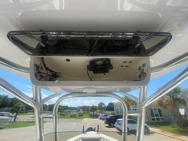 2024 Key West 239 FS boat console with electronics and overhead storage.