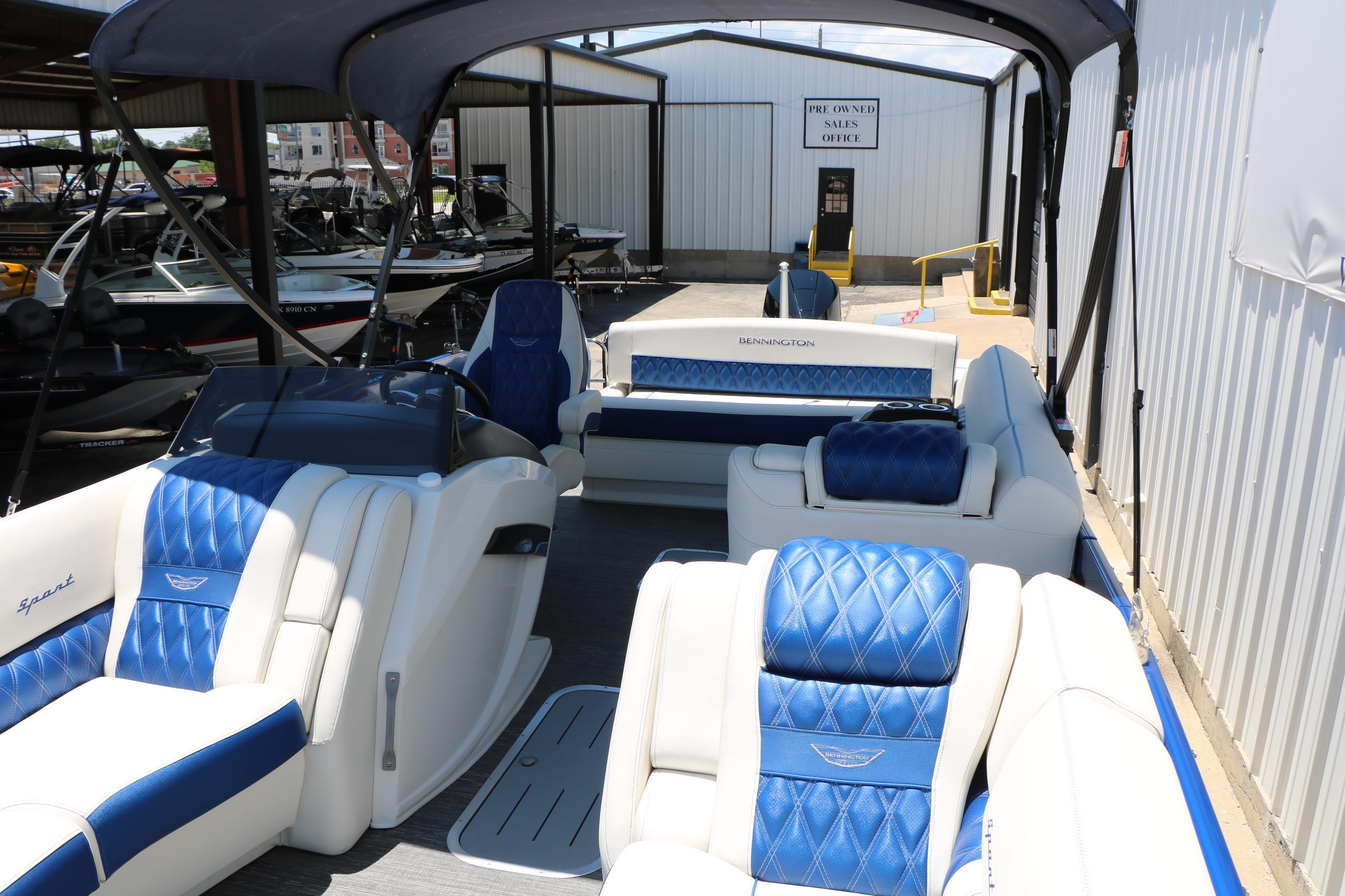 2024 Bennington 23 RX Swingback pontoon boat with luxurious blue and white seating.