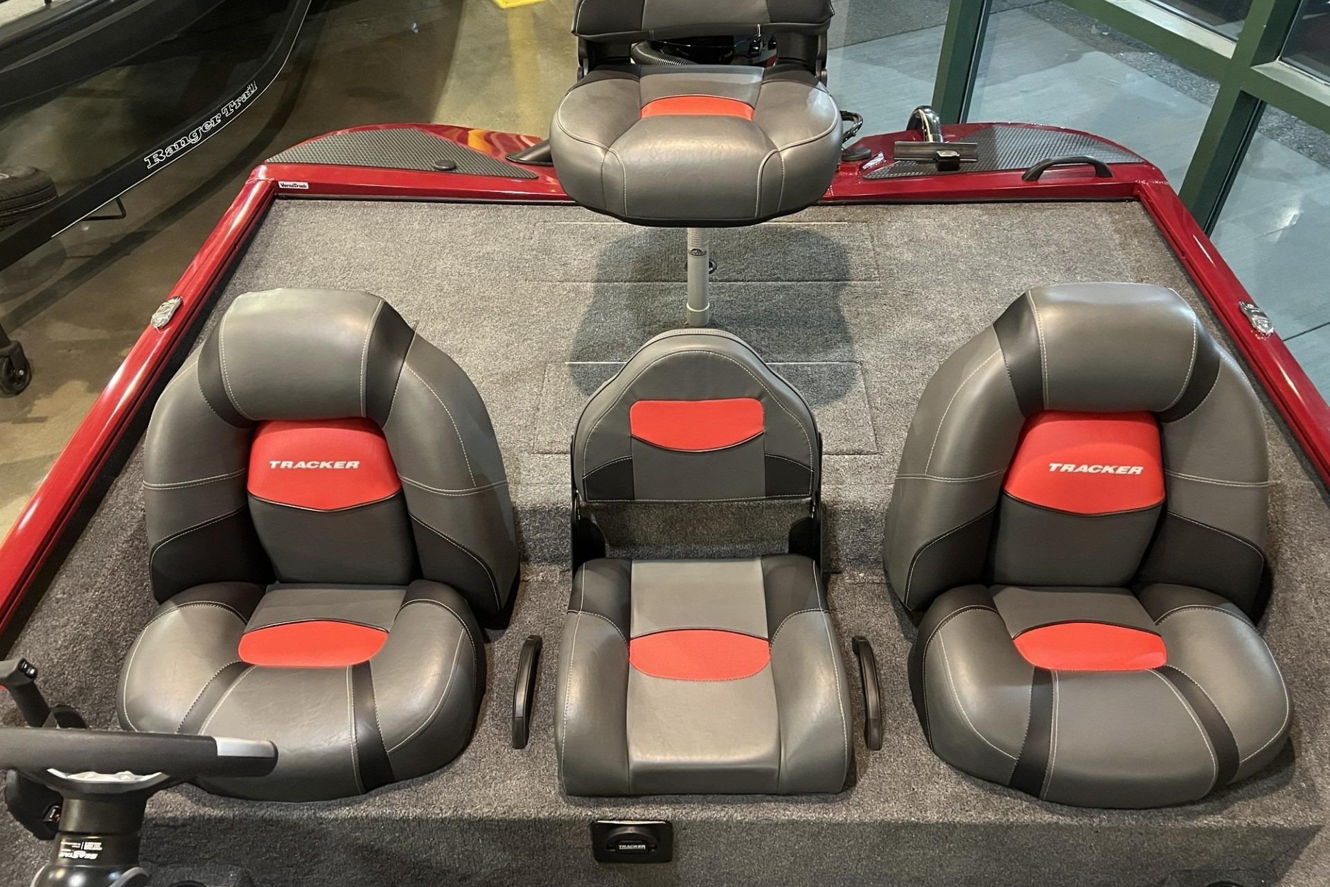 2025 Tracker Savage 215 boat interior with gray and red seating arrangement.