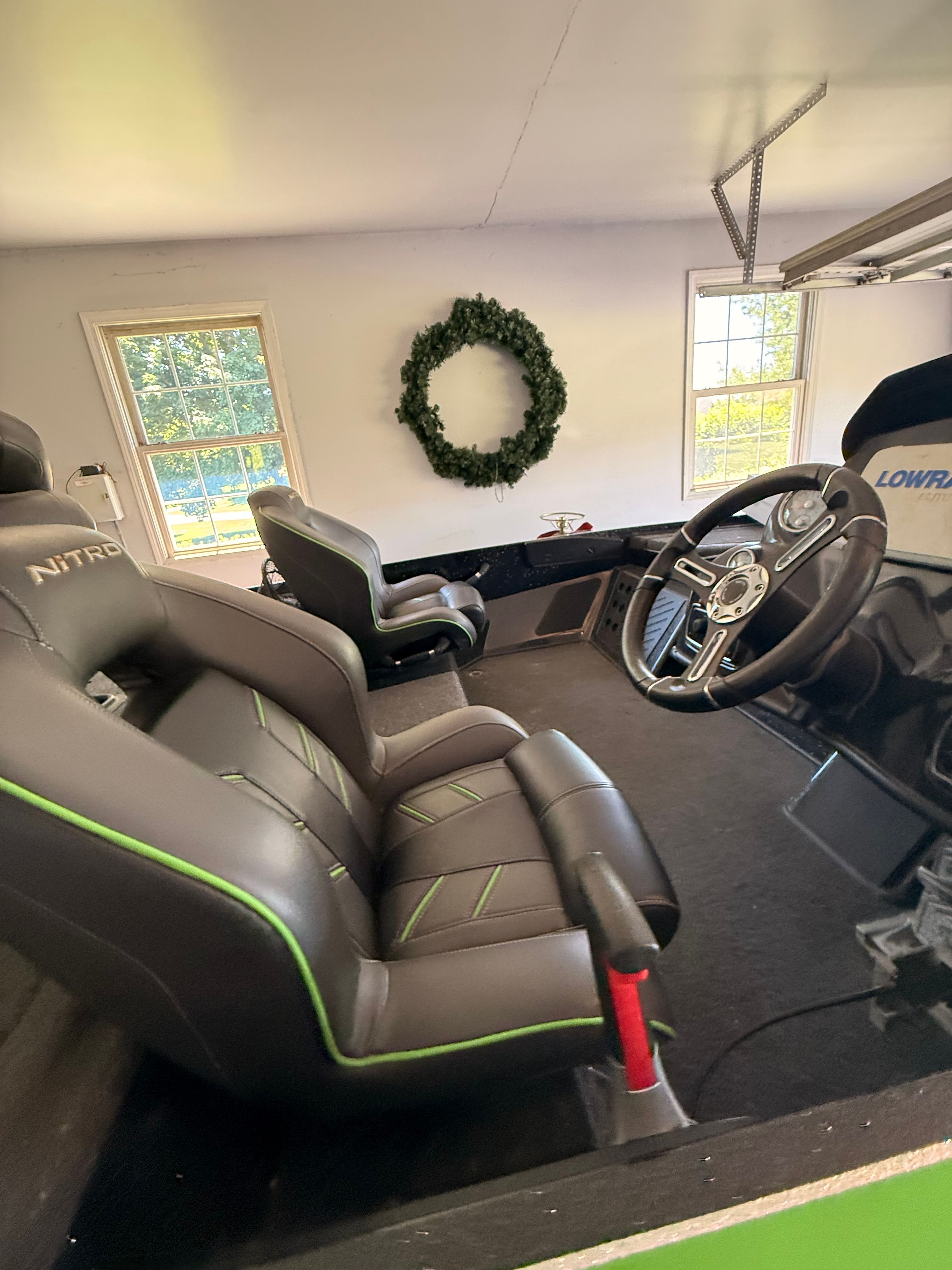 Interior of a 2018 Nitro Z19 Pro boat in a garage.