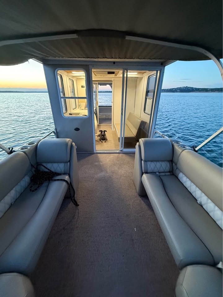 Interior of a 2008 Sun Tracker Party Cruiser on water.