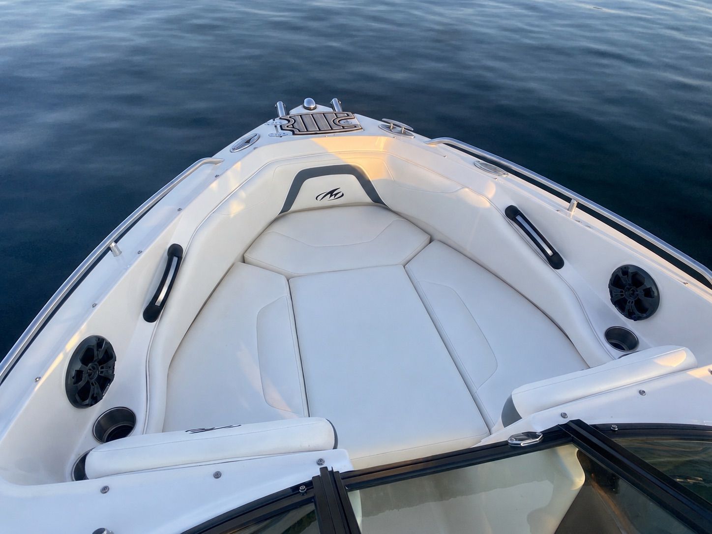 Monterey 204FSX 2013 boat with white interior on calm water.