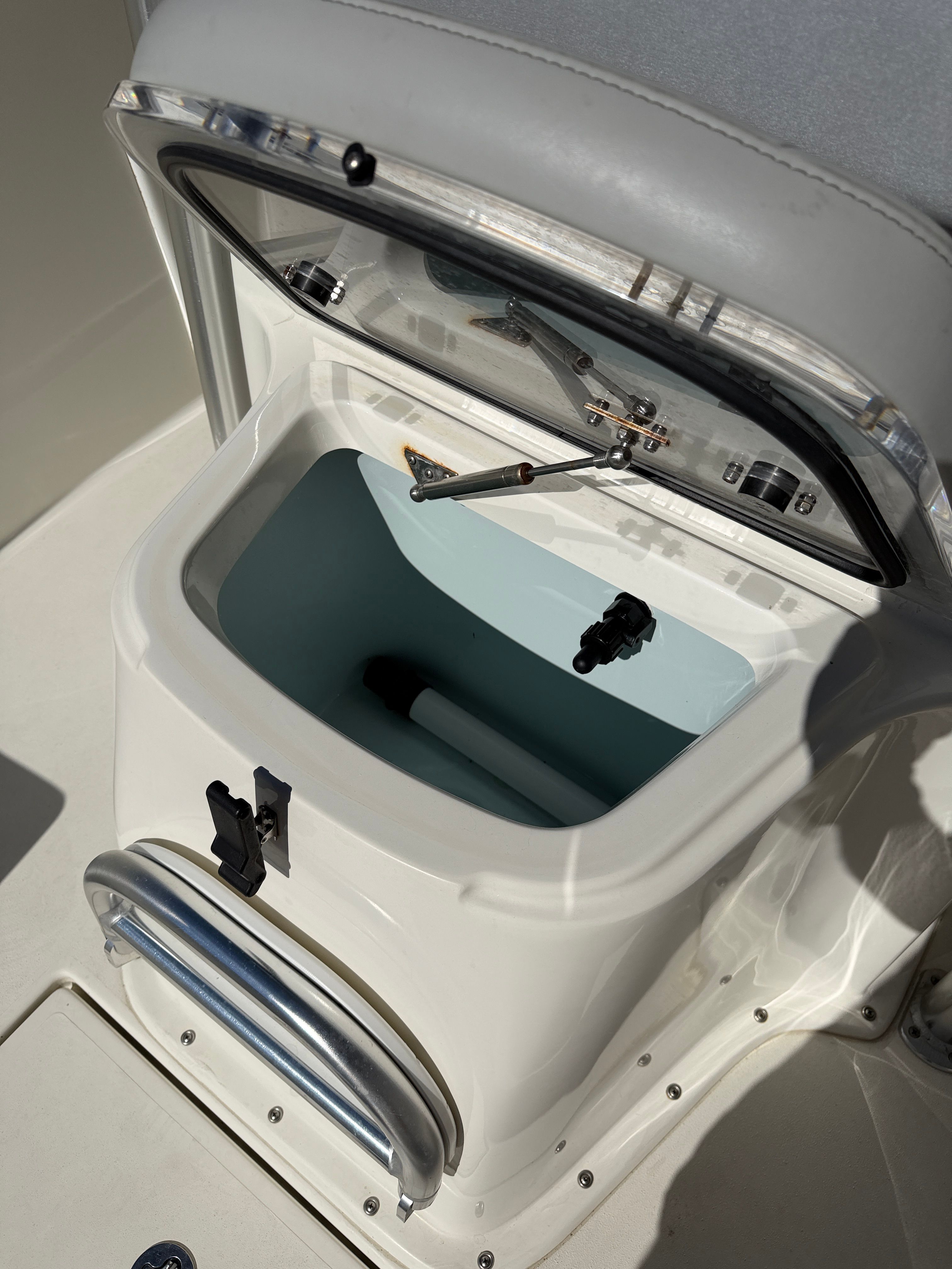 Open storage compartment on a 2021 KenCraft Challenger boat.