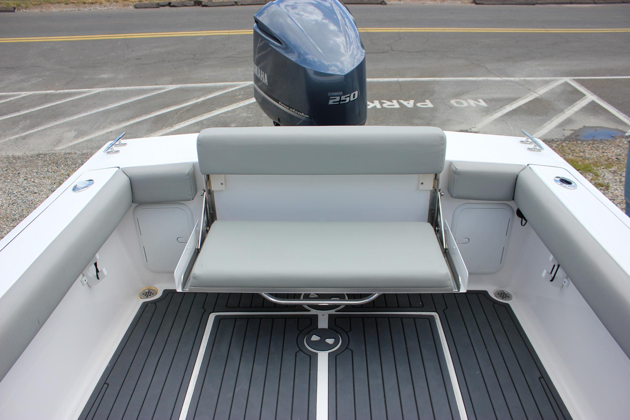 2022 NorthCoast 235 Cabin boat interior with seating and Yamaha 250 engine.