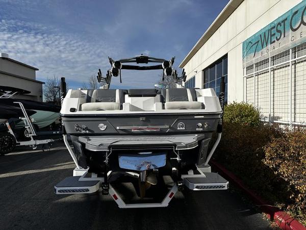 2025 Malibu Wakesetter 26 LSV boat, rear view, parked outside West Coast Boat Center.