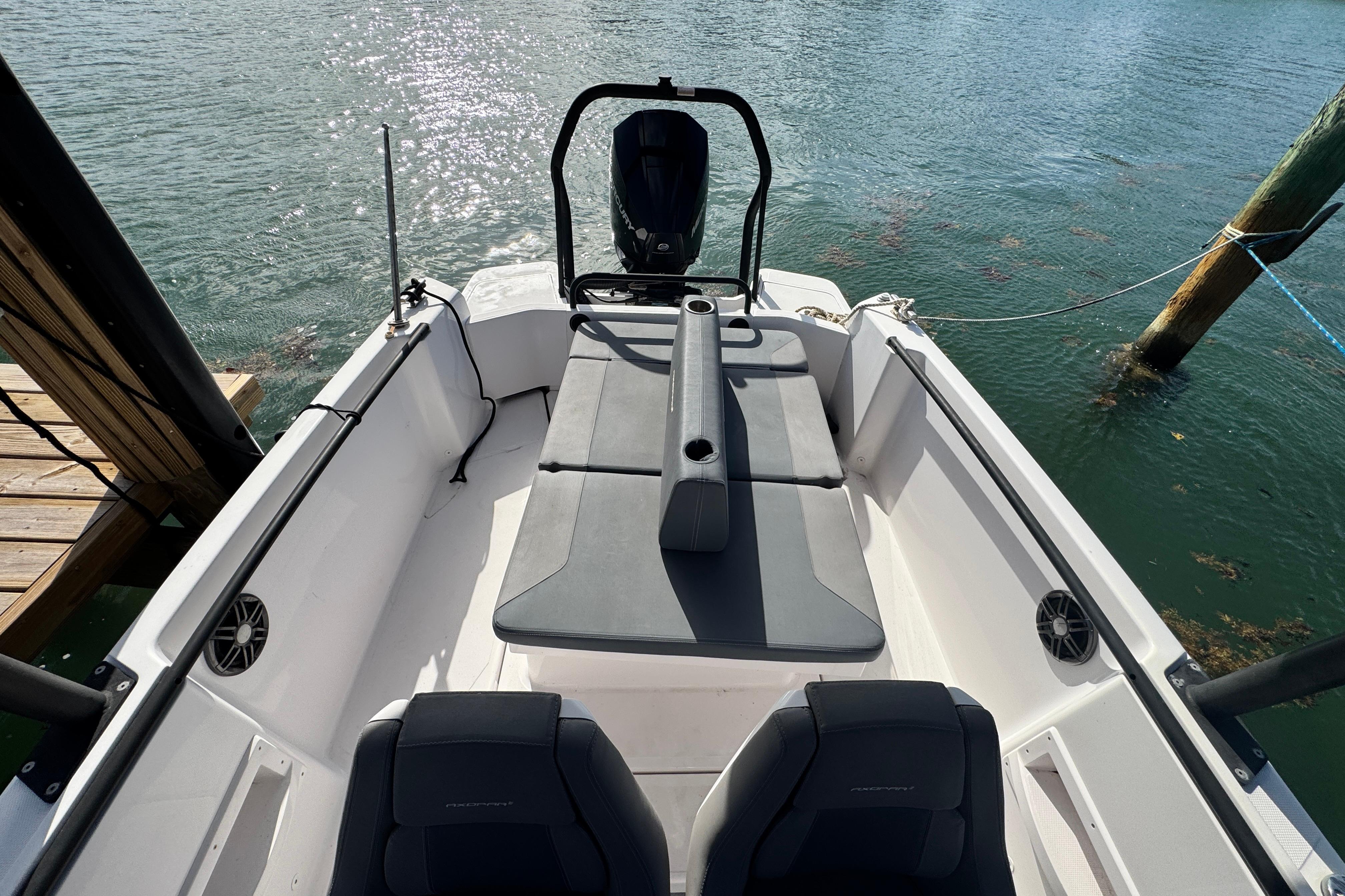 2022 Axopar 22 T-Top boat interior with seating and water view.