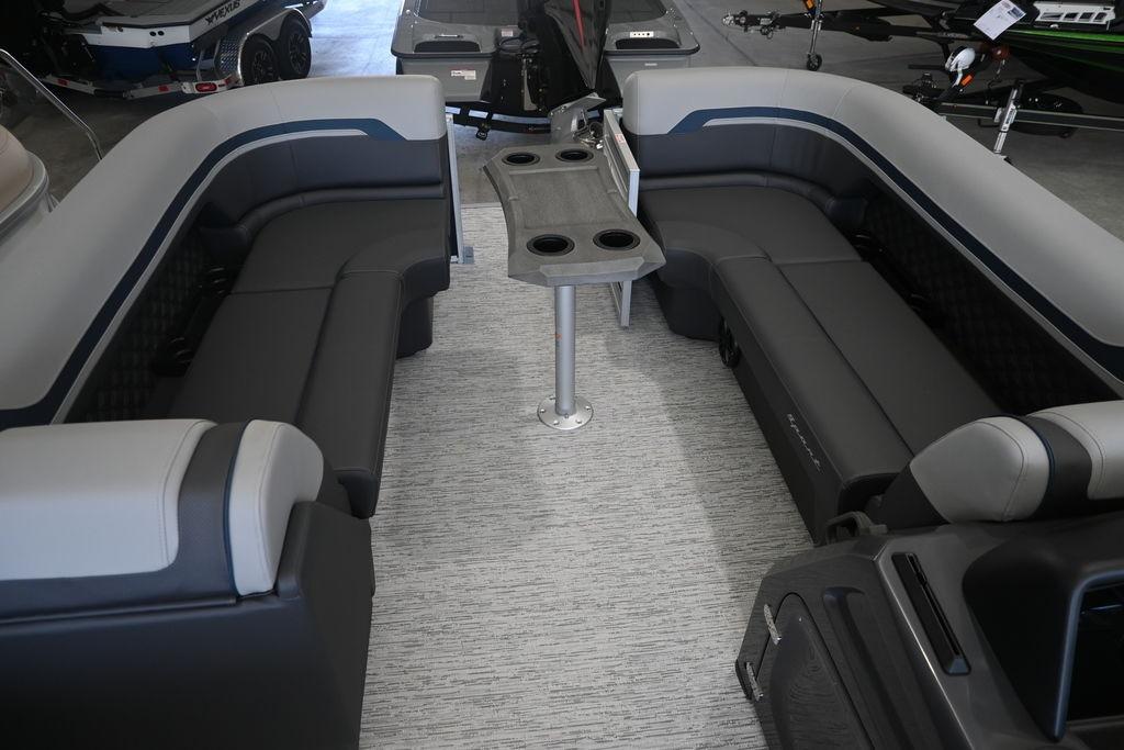2026 Bennington S Swingback 23 SSB interior with plush seating and central table.
