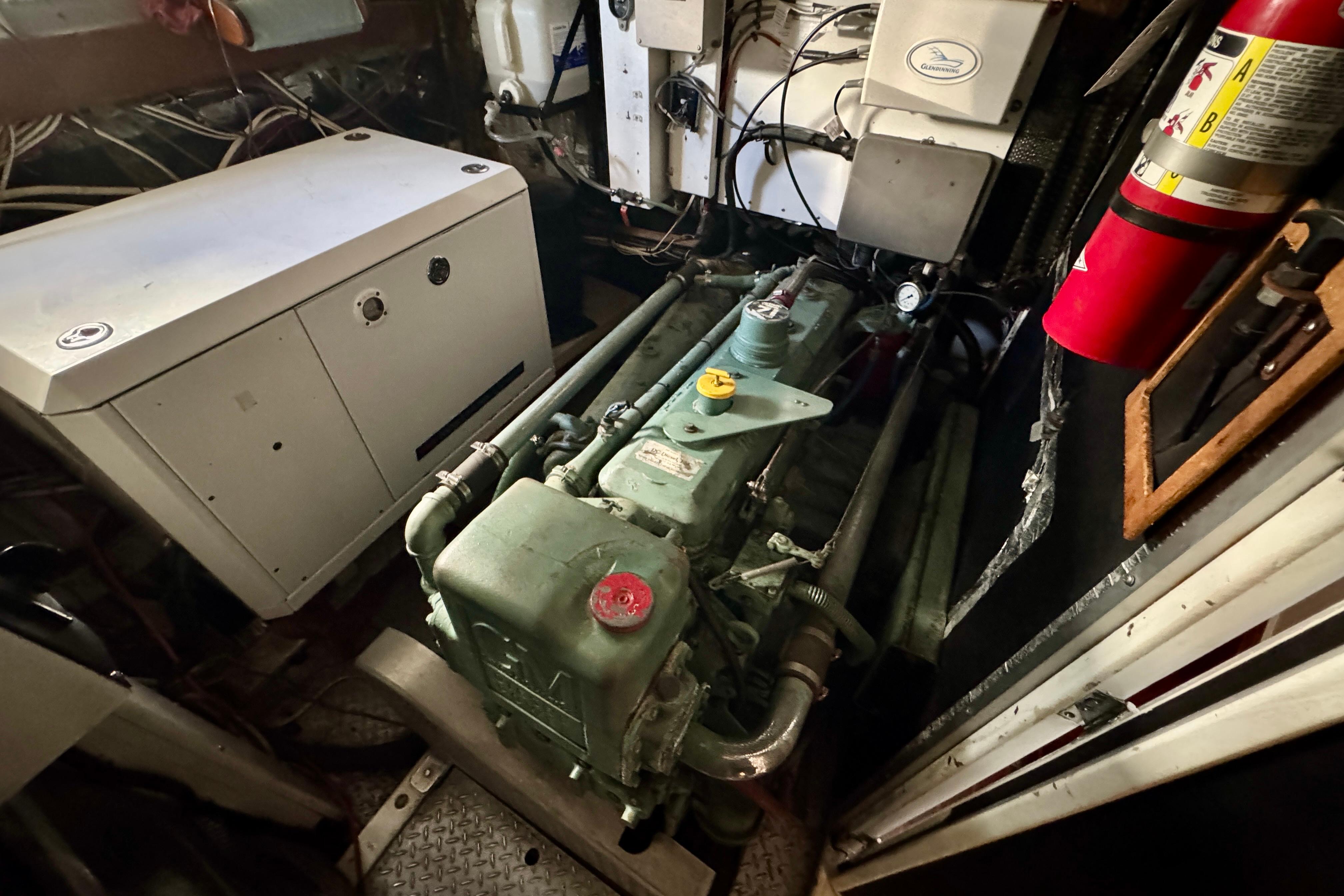 Engine room of a 1958 Blanchard Pilothouse boat, featuring machinery and equipment.