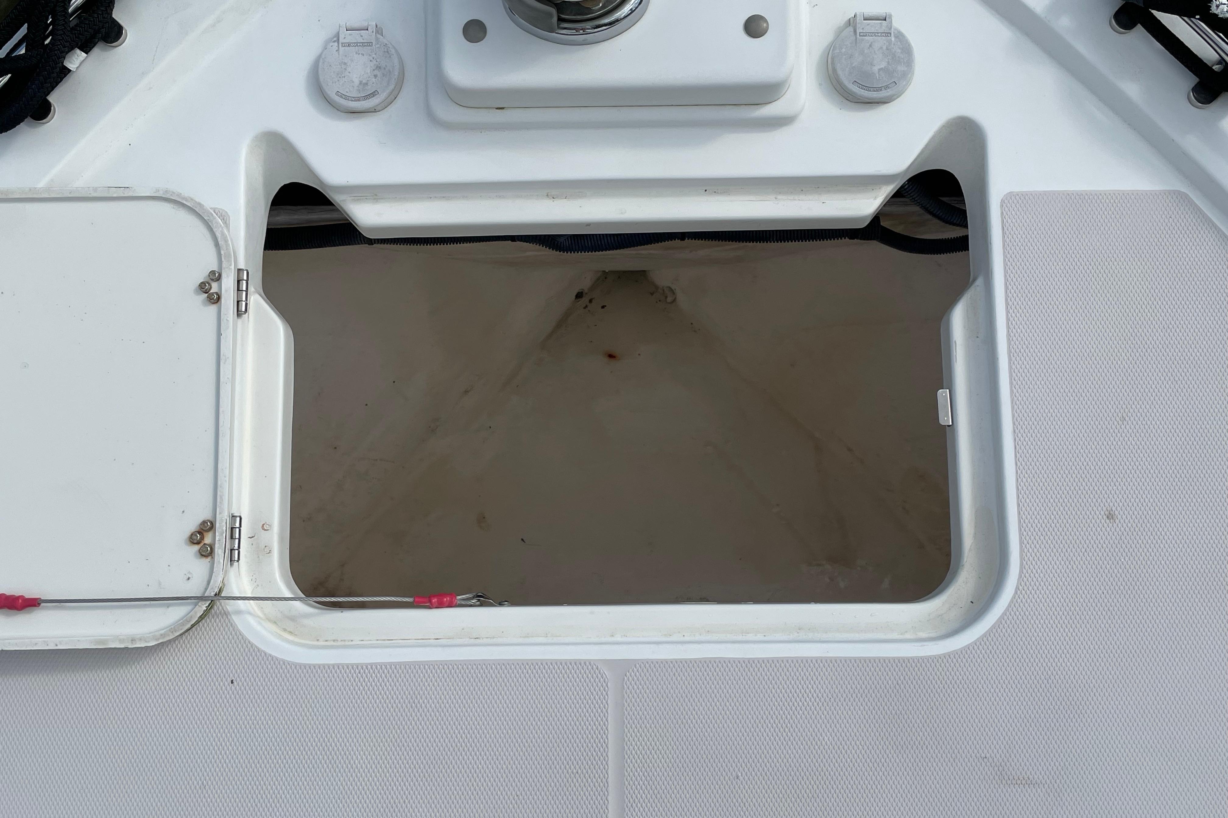 Open hatch on 2007 Back Cove 29 boat deck, showing interior compartment.
