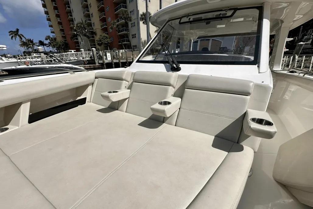 2019 Boston Whaler 350 Realm boat interior with beige seating and cup holders.