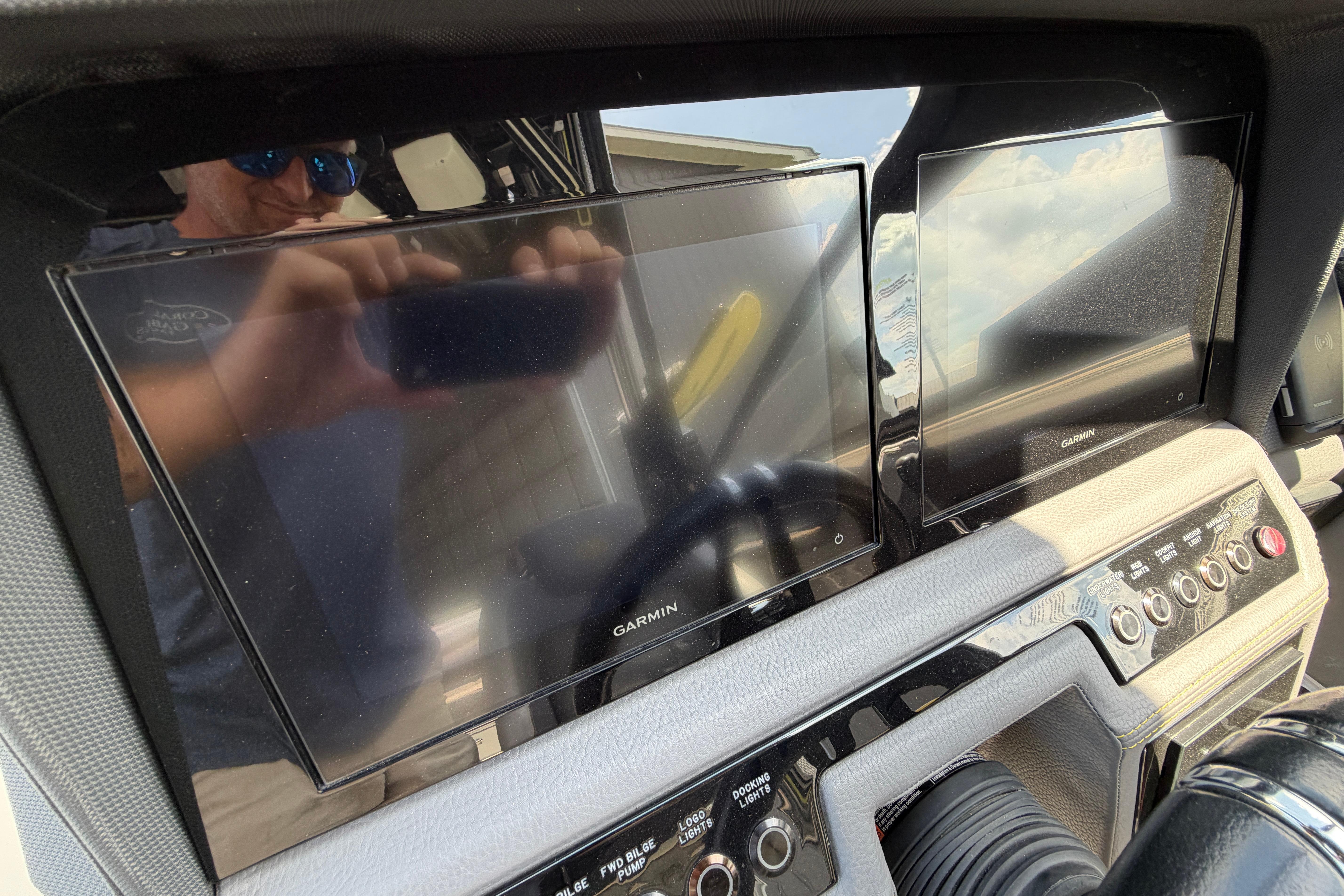 Dashboard of a 2021 Cobalt R8 Surf boat with Garmin displays.