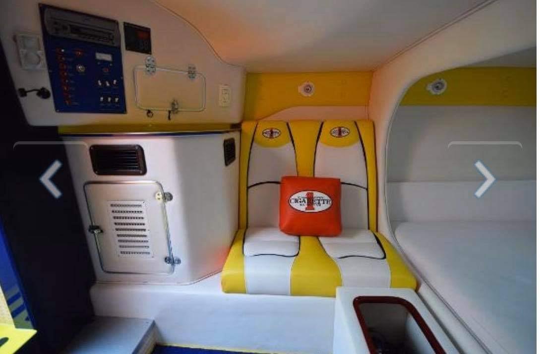 Interior of 2009 Cigarette 399 Vee boat with yellow and white seating.