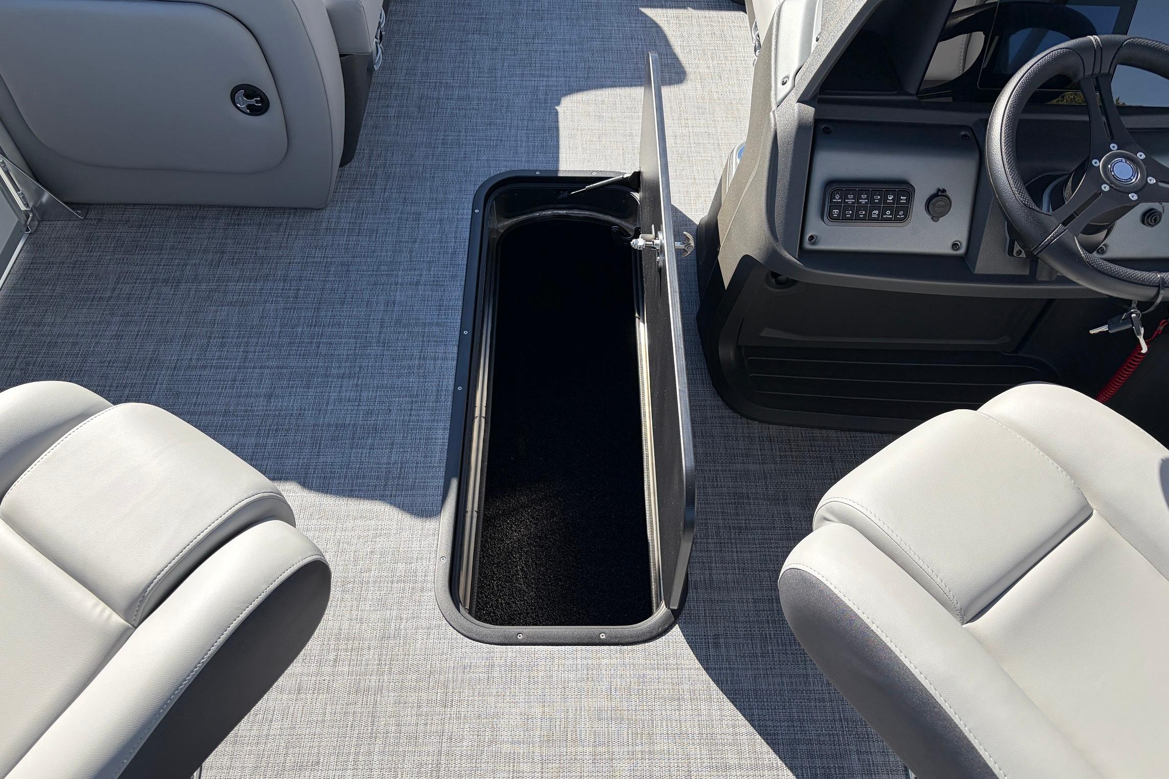 2026 Sun Tracker Party Barge 22 RF XP3 interior with open storage compartment and seating.