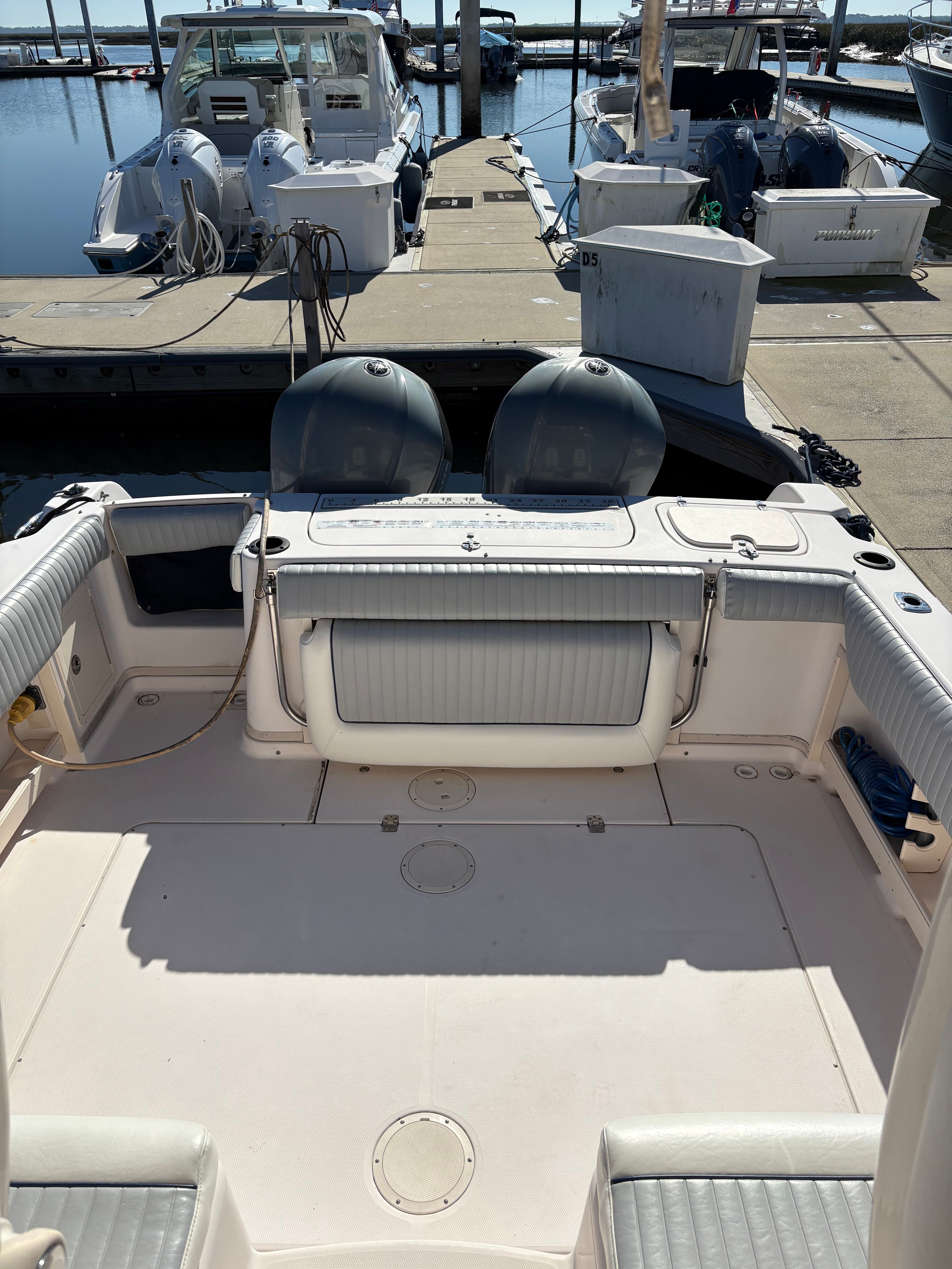 2009 Grady-White Chesapeake 290 boat at dock with engines.