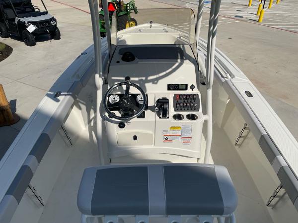 2024 Mako 214 CC boat interior with steering console and seating.