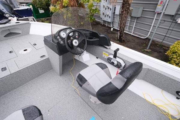 2024 Crestliner 1600 Vision boat interior with steering console and seating.