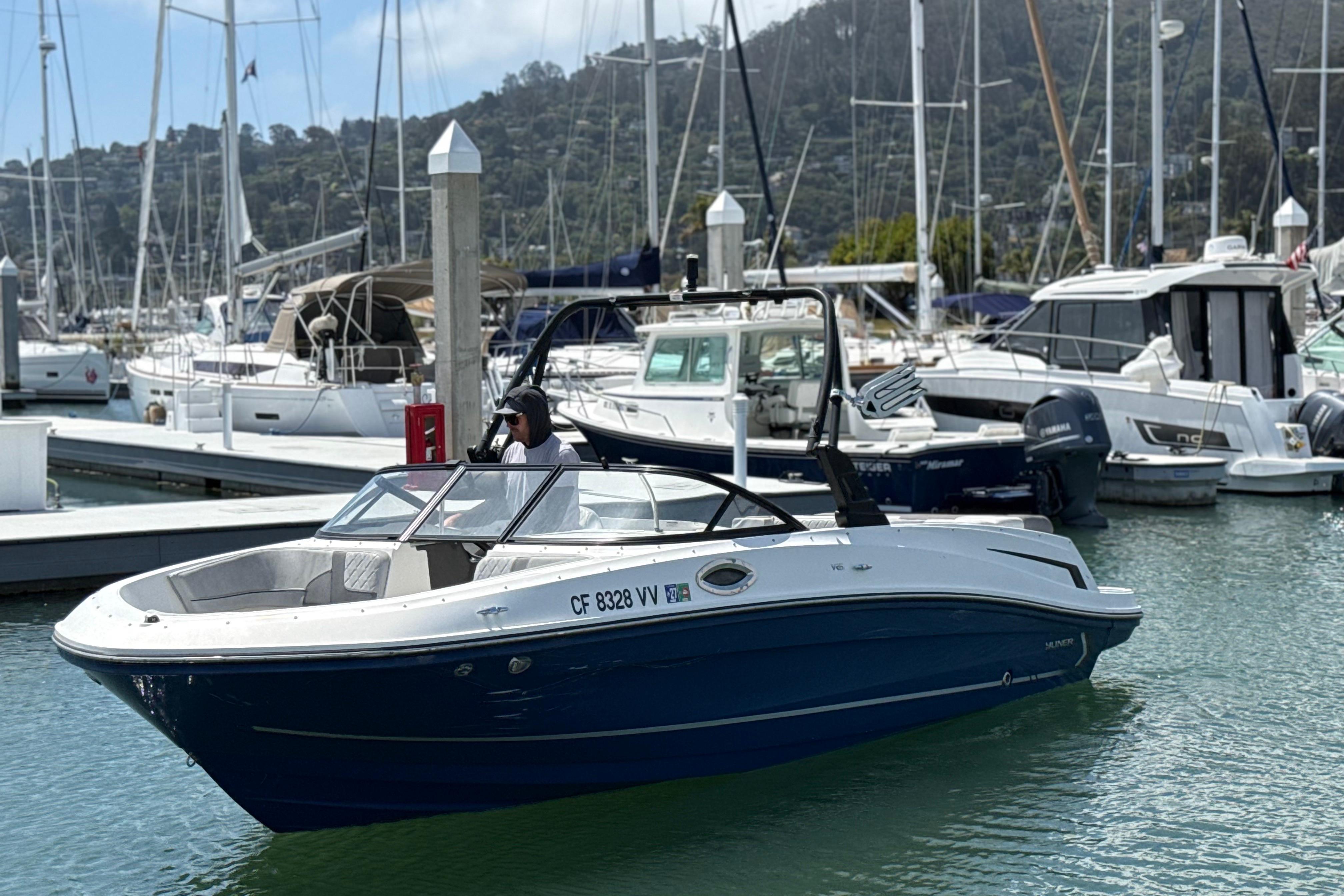 2021 Bayliner VR5 Bowrider I/O in marina, surrounded by other boats.
