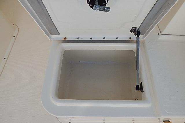 Open storage compartment on a 2003 World Cat 270 EC boat.