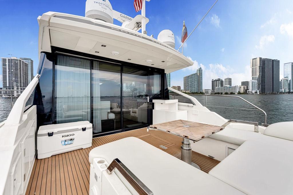 Luxury Fairline Targa 58 yacht deck with city skyline, 2012 model.