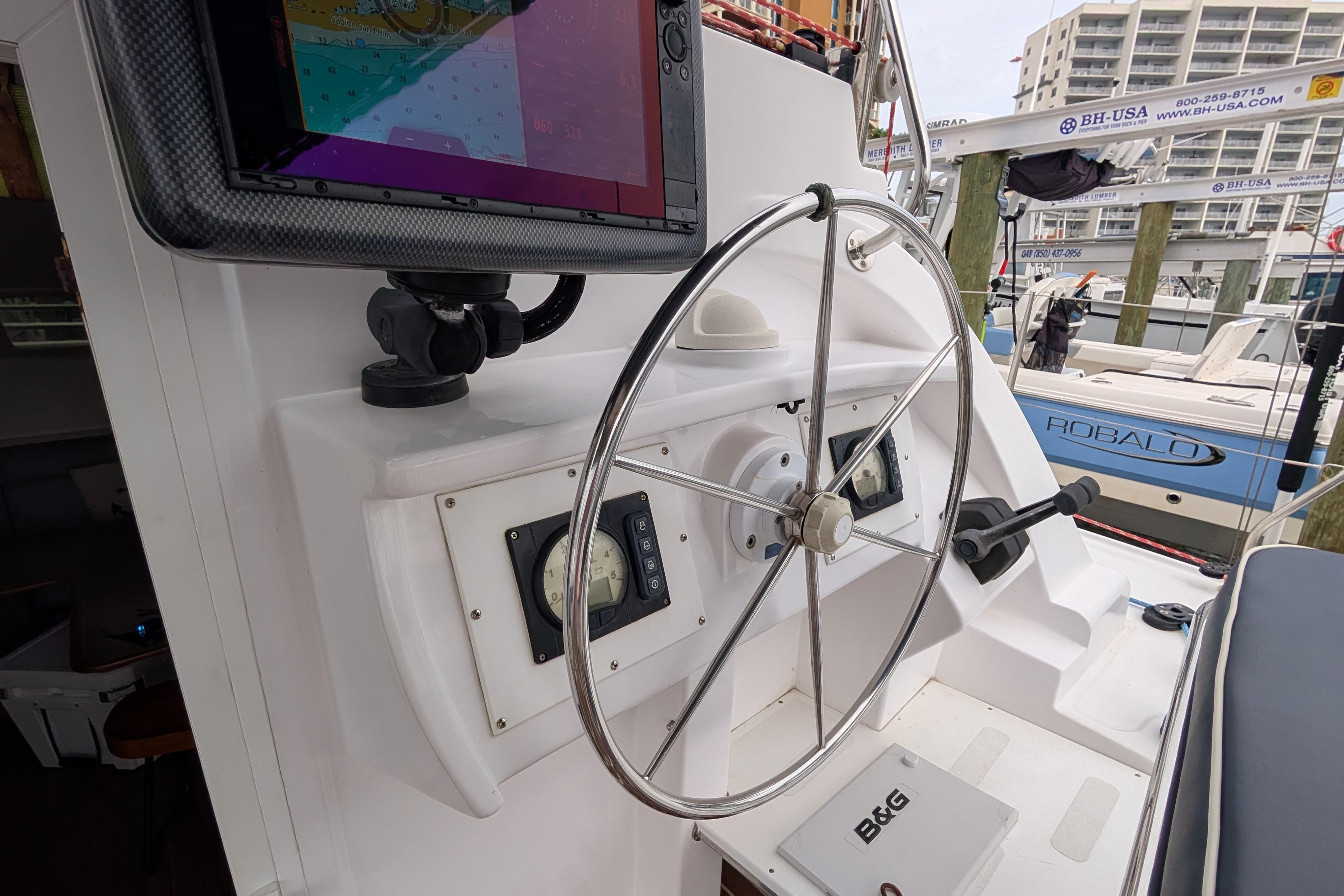 Steering wheel and navigation equipment on a 1999 Island Spirit 37 yacht.
