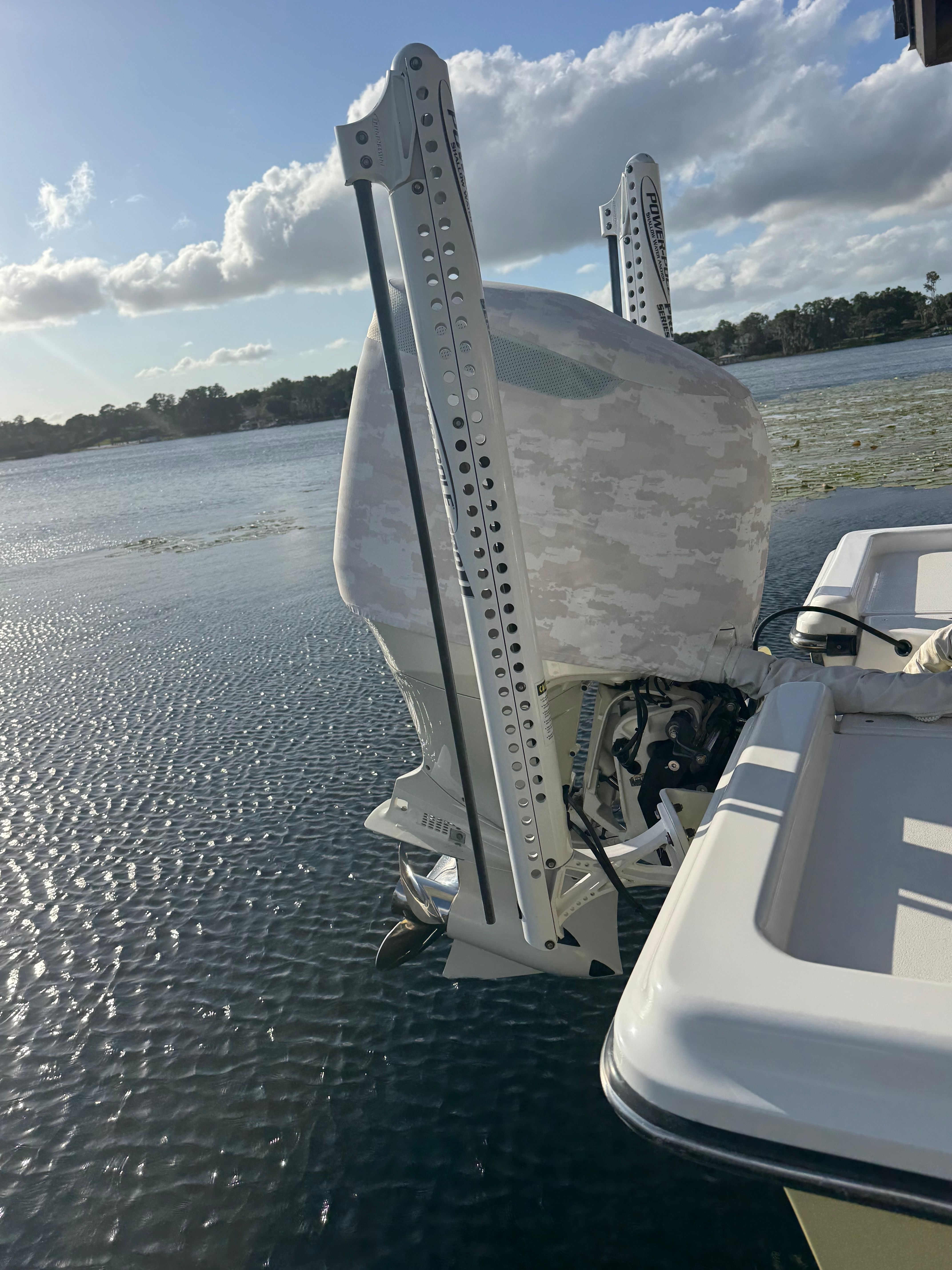ShearWater LTZ 2004 boat motor on calm water at sunset.