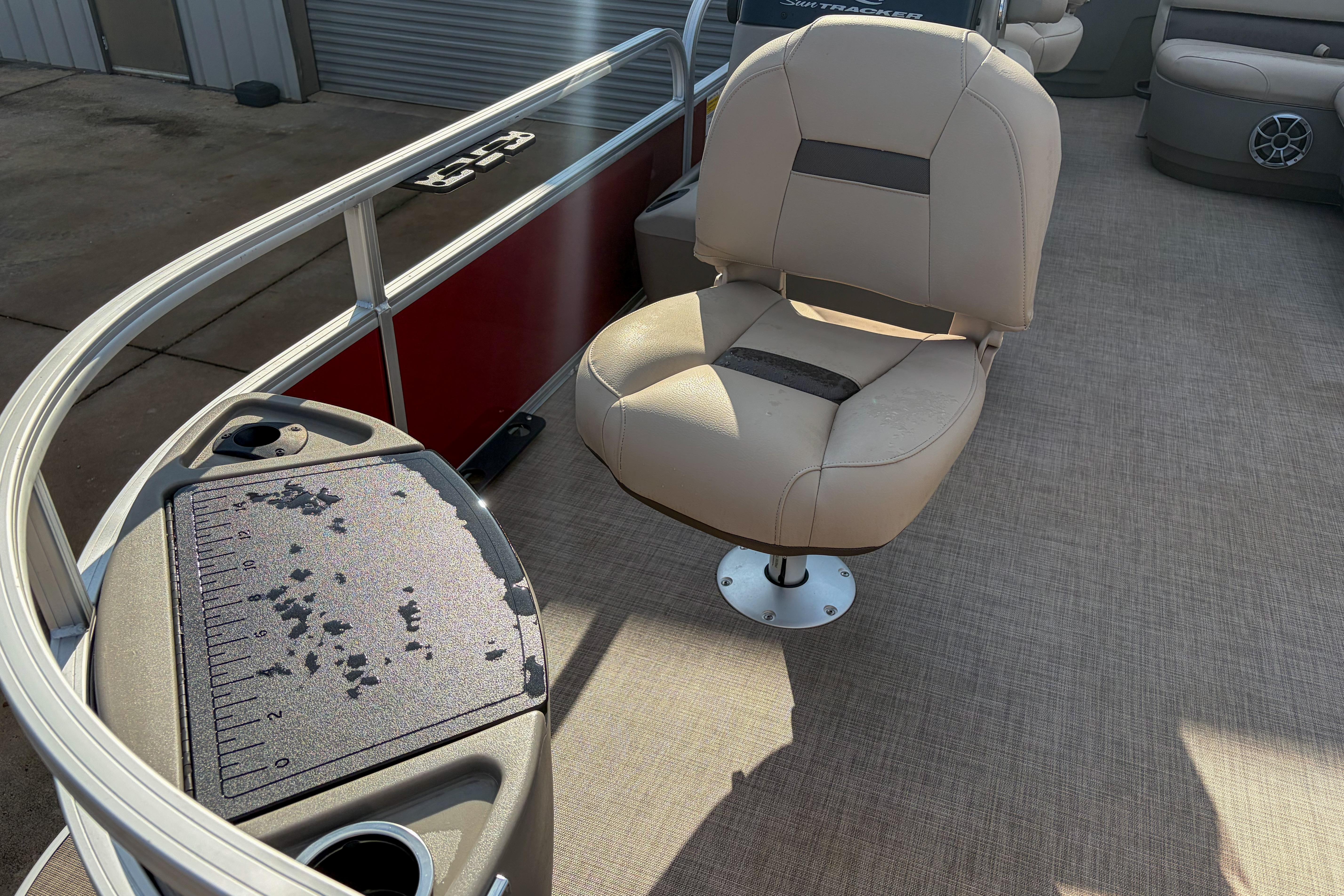2024 Sun Tracker Bass Buggy 18 DLX interior with fishing seat and measuring board.