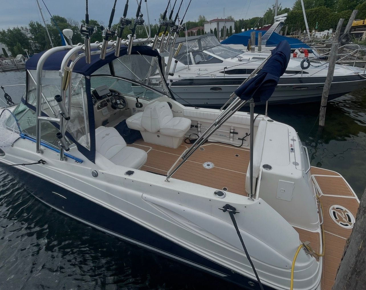 2006 Sea Ray 270 Amberjack boat docked at marina.
