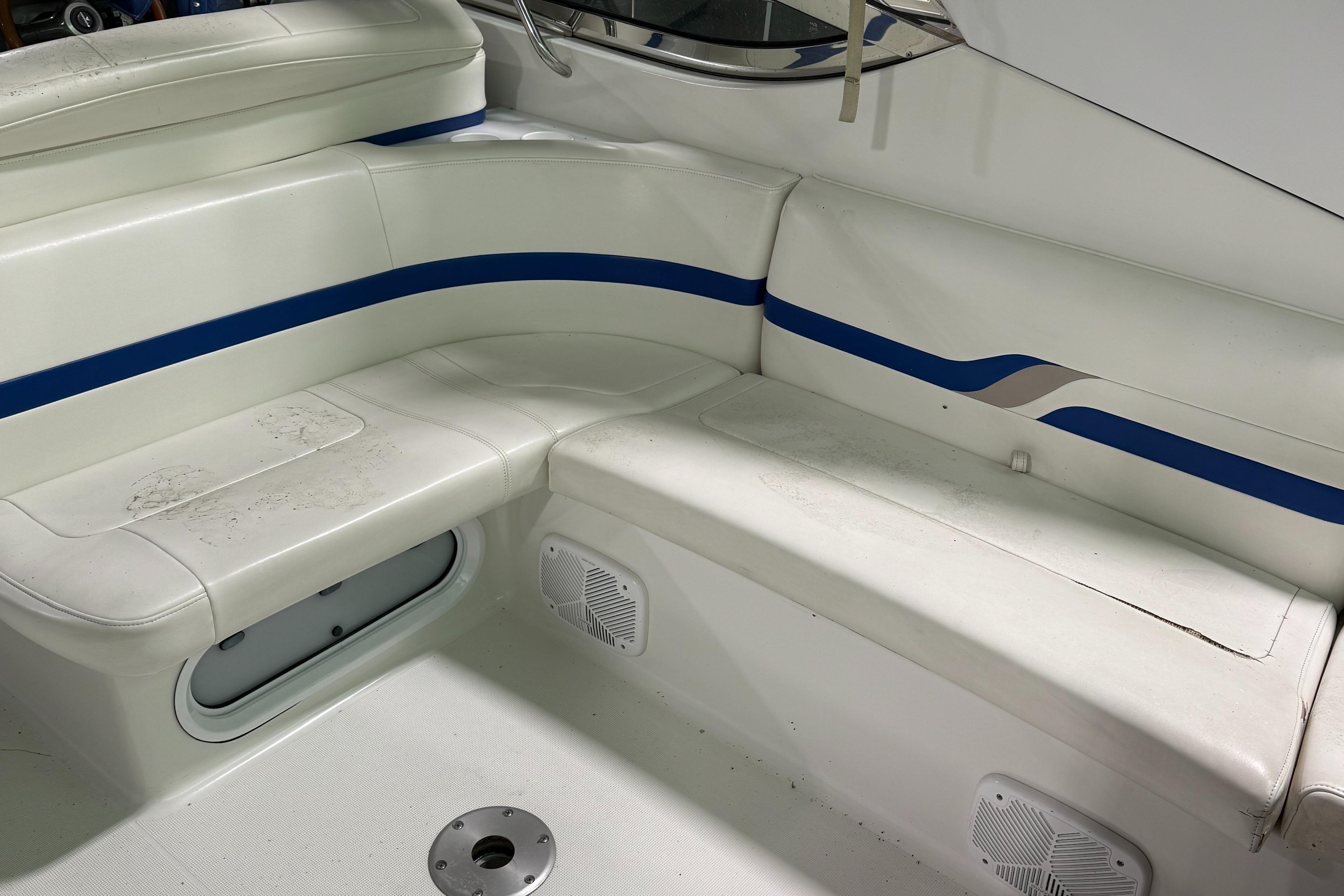 2002 Formula 400 Super Sport boat interior with white and blue seating.