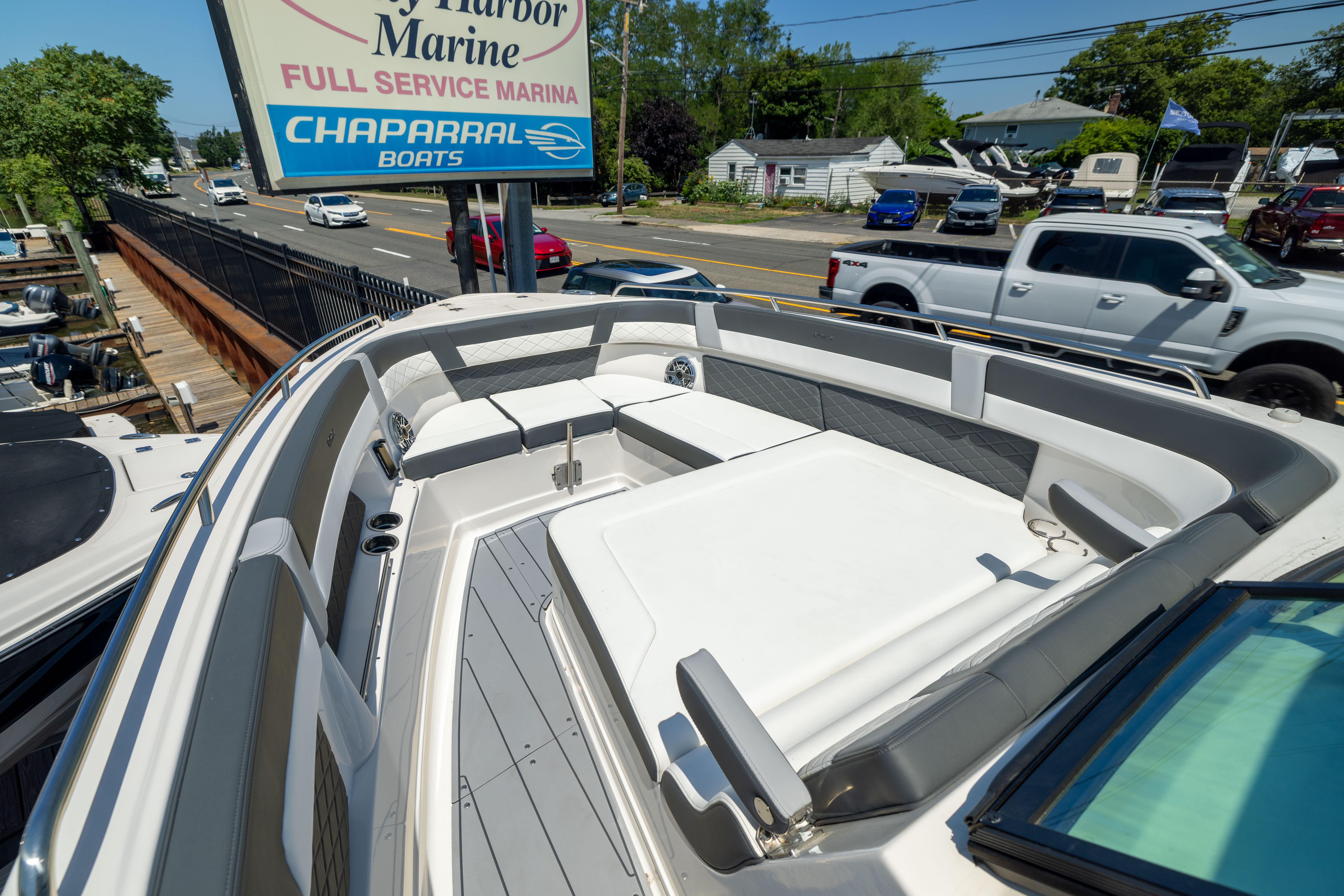 2026 Chaparral 310 OSX boat displayed at a full-service marina.