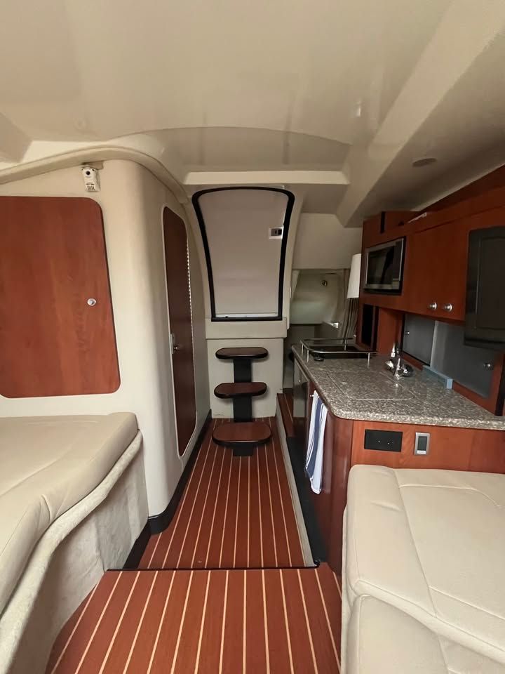 Interior of a 2011 Monterey 280SCR yacht with modern amenities.