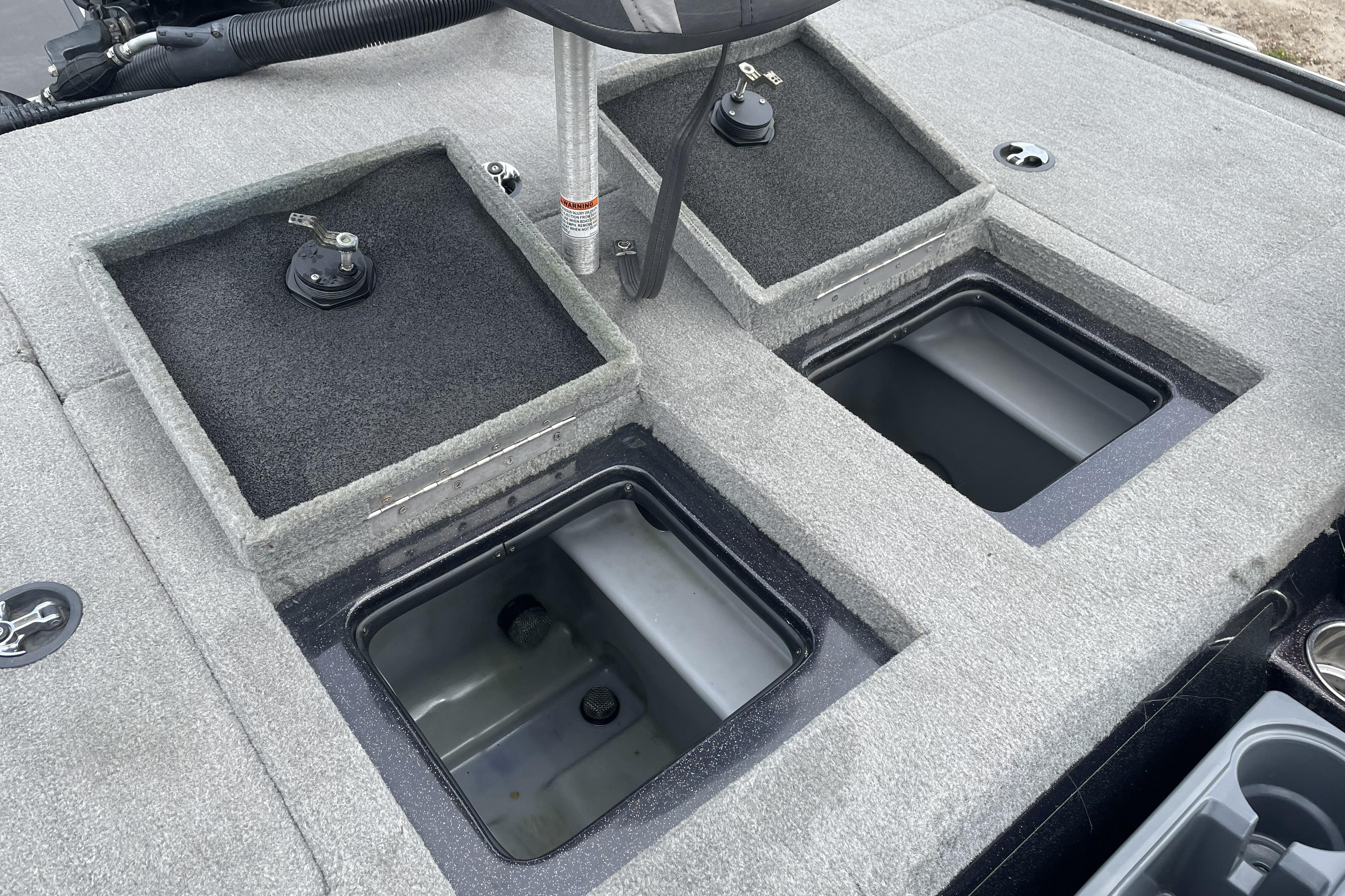 2013 Nitro Z-8 boat storage compartments with open lids, showcasing interior space.