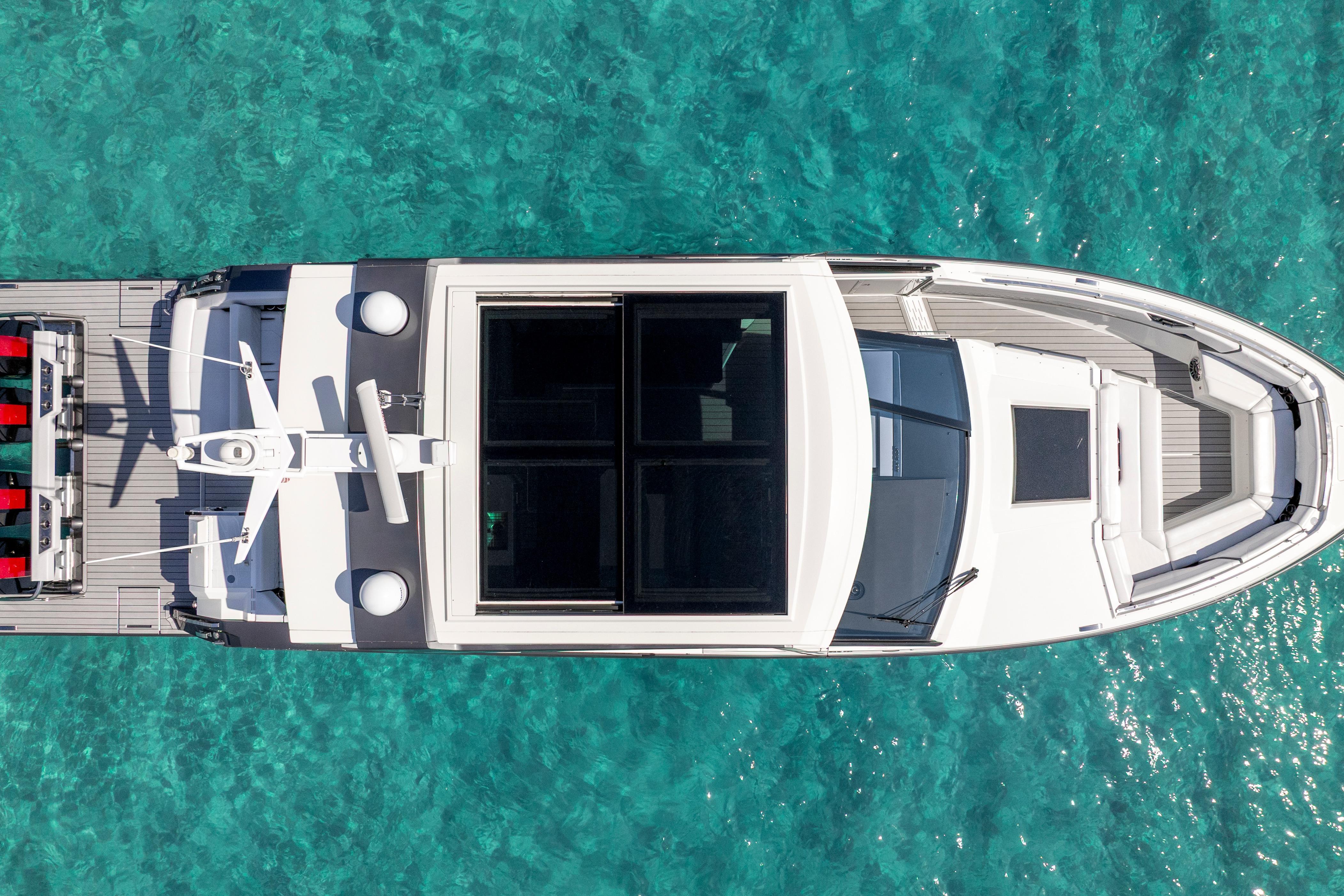 Top view of 2022 Formula 500 Super Sport Crossover yacht on clear turquoise water.