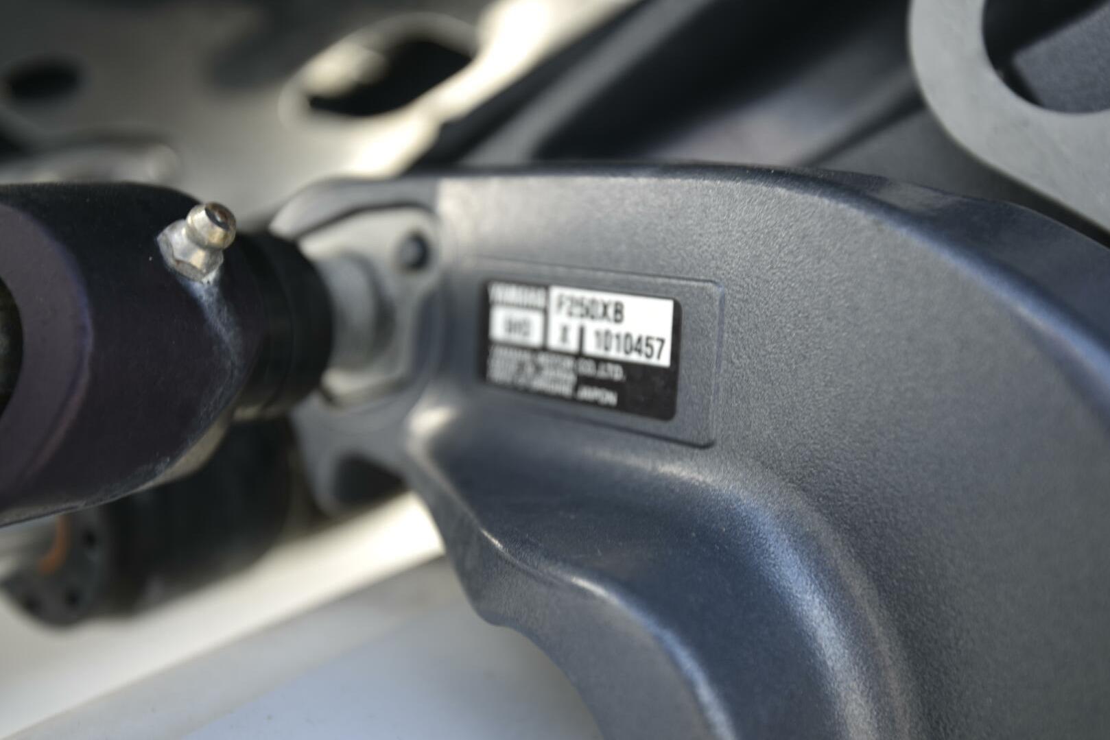 Close-up of a 2023 Sea Pro 239 Deep V CC engine component with serial number.