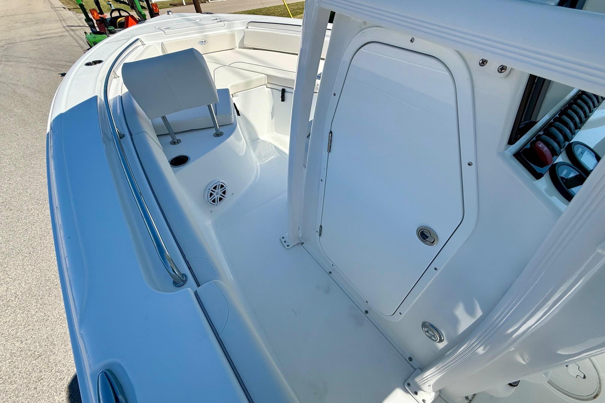 2026 Sea Hunt Ultra 229 boat interior with seating and storage compartment.