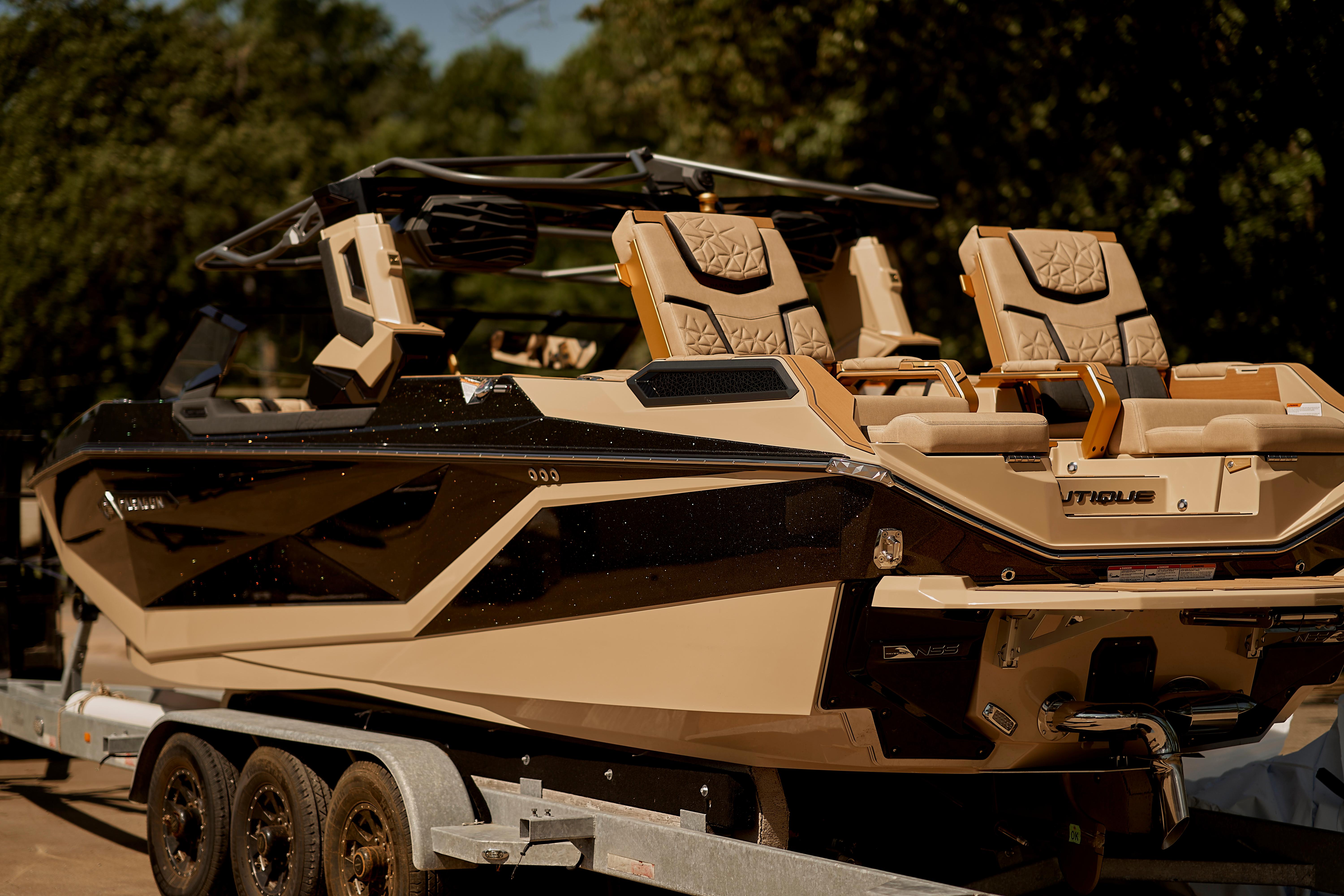2025 Nautique Super Air Nautique G25 Paragon boat on trailer, side view.