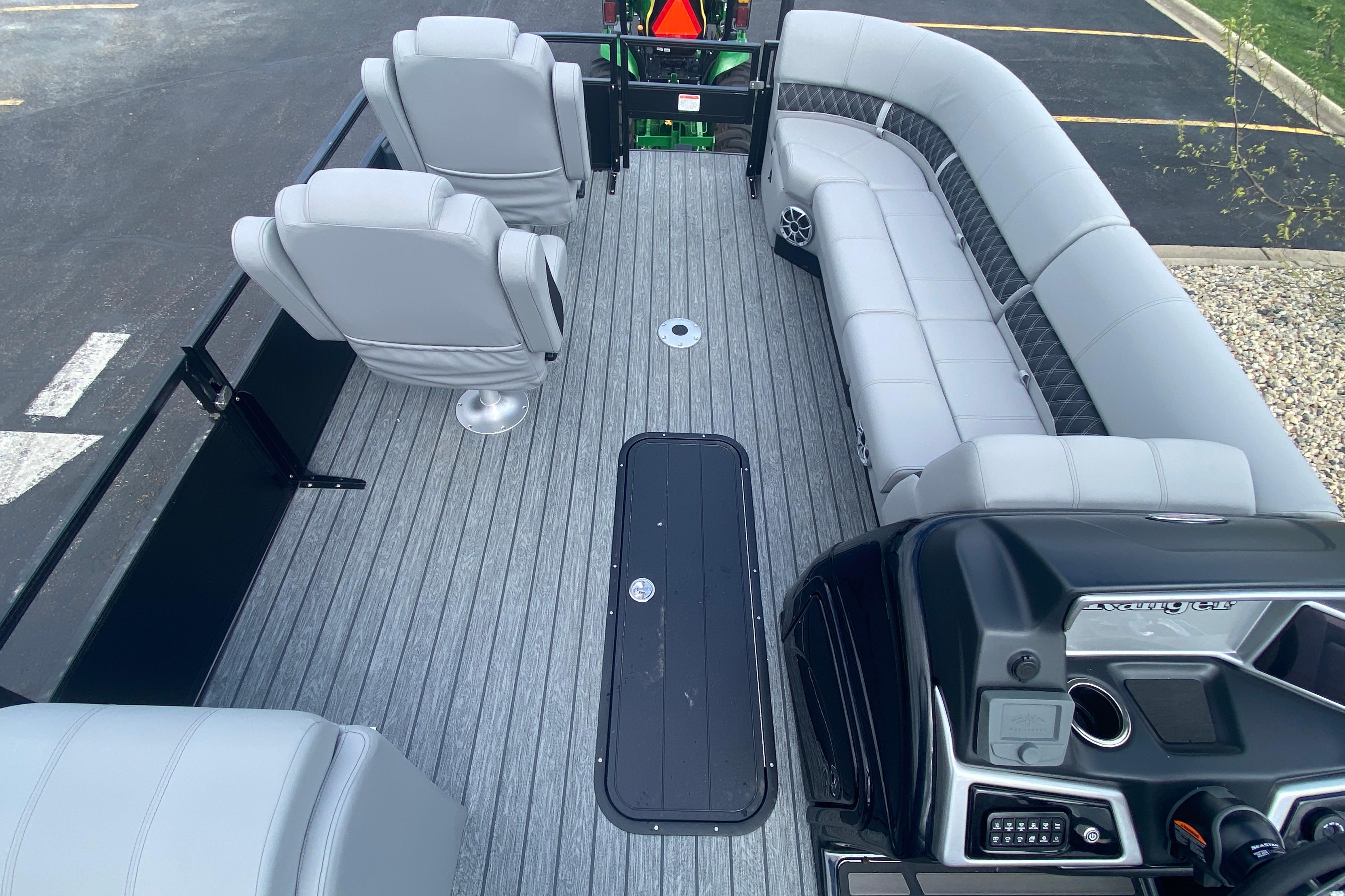 2026 Ranger 223FC boat interior with gray seating and modern dashboard.
