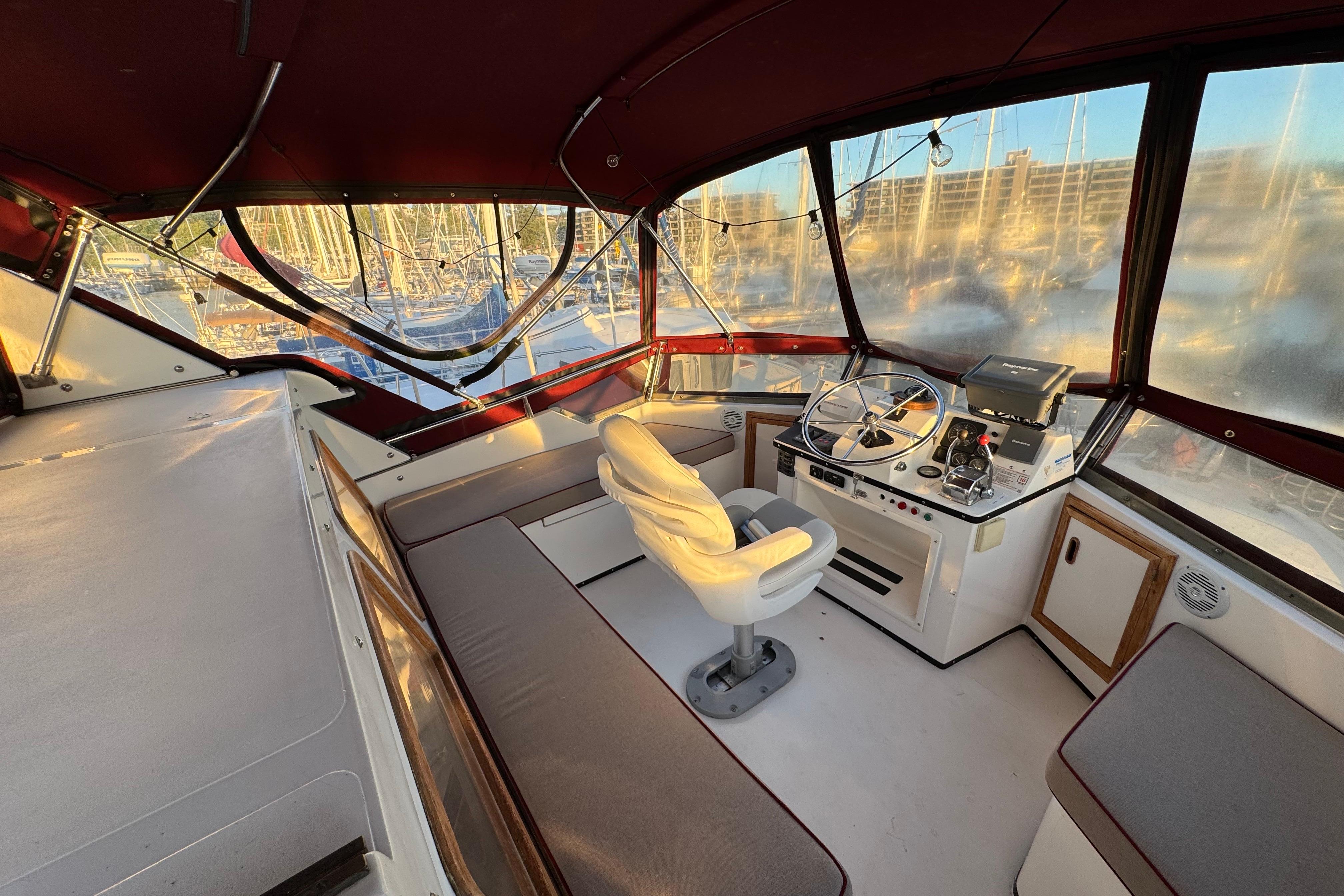 Interior of a 1987 President 37 yacht with helm and seating area.