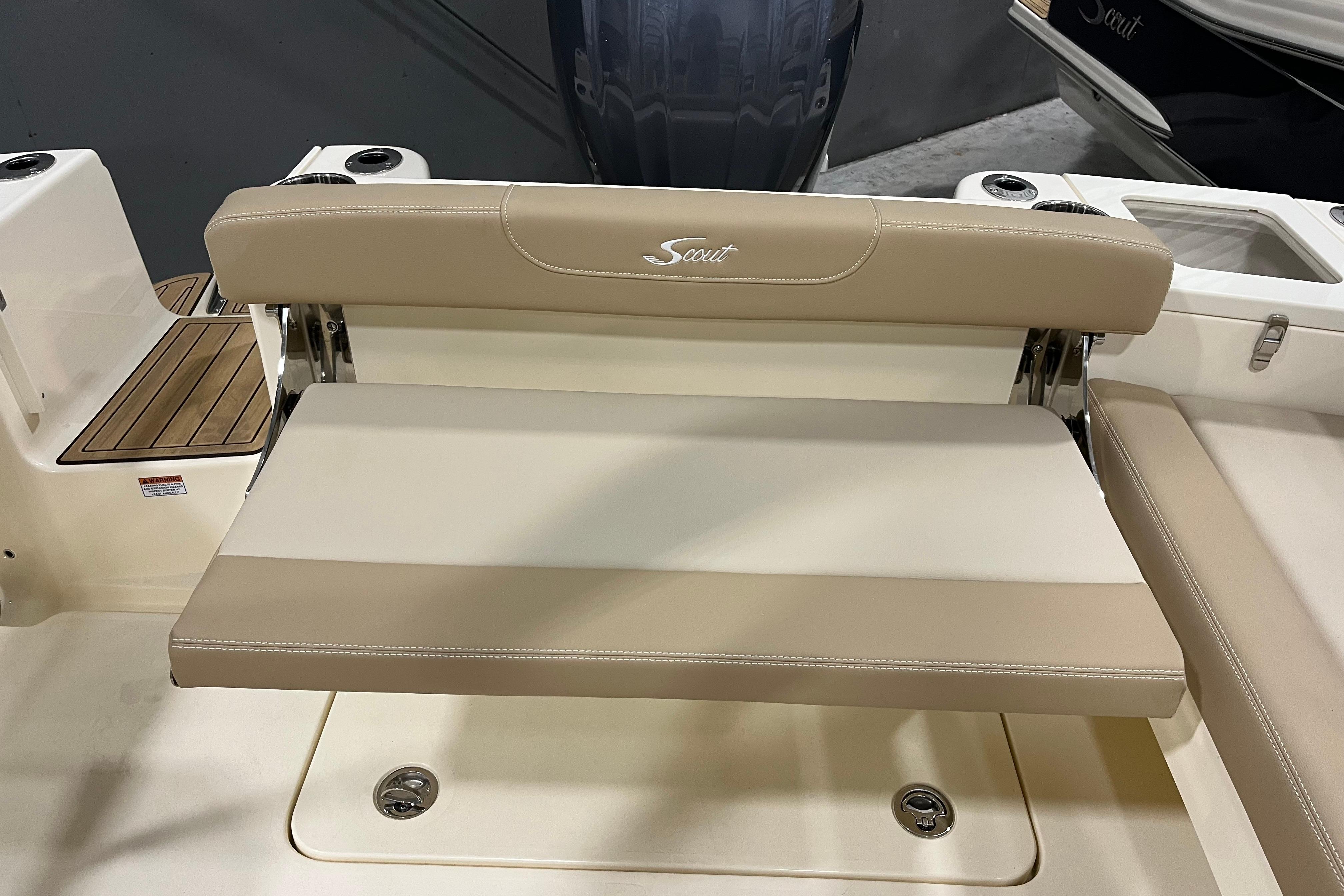 2025 Scout 215 Dorado boat seat with beige upholstery and foldable design.