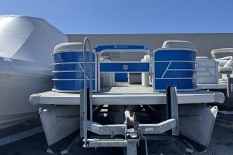 2021 Godfrey Sweetwater 2286 C pontoon boat with blue accents, docked outdoors.