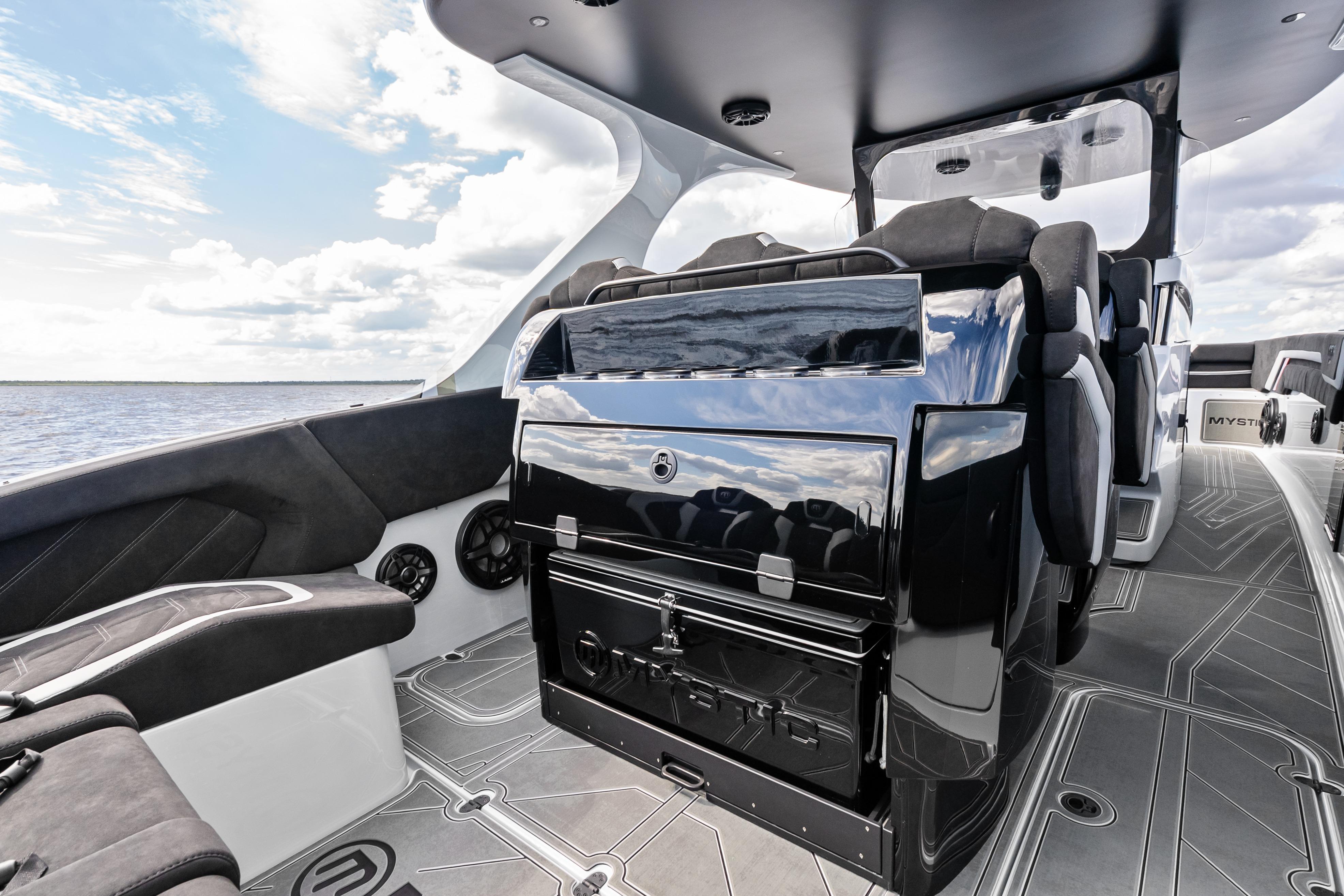 2027 Mystic Powerboats M4200 interior with sleek seating and modern design on open water.